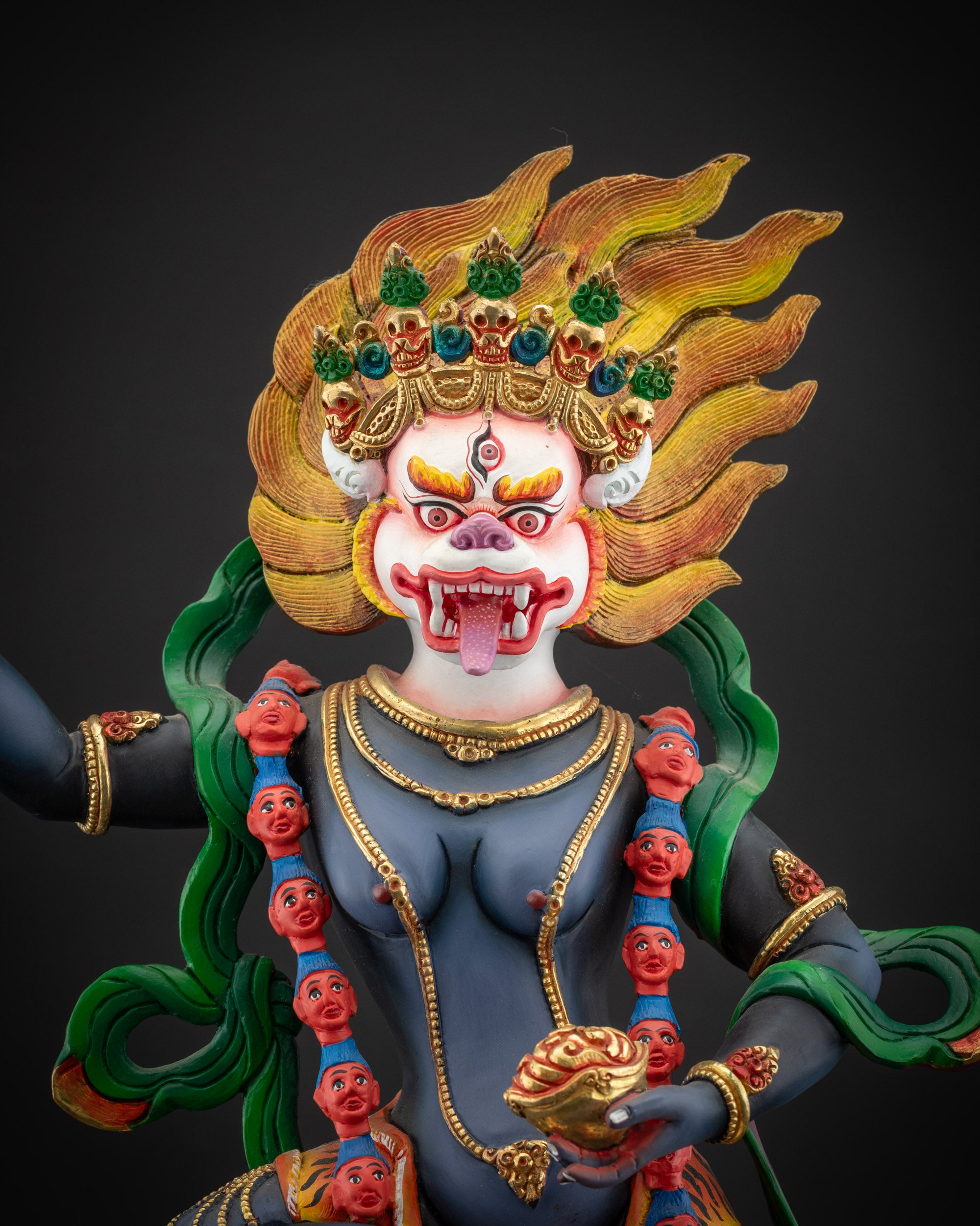 regular close up Simha Mukha statue showing intricate details of garments and adornments