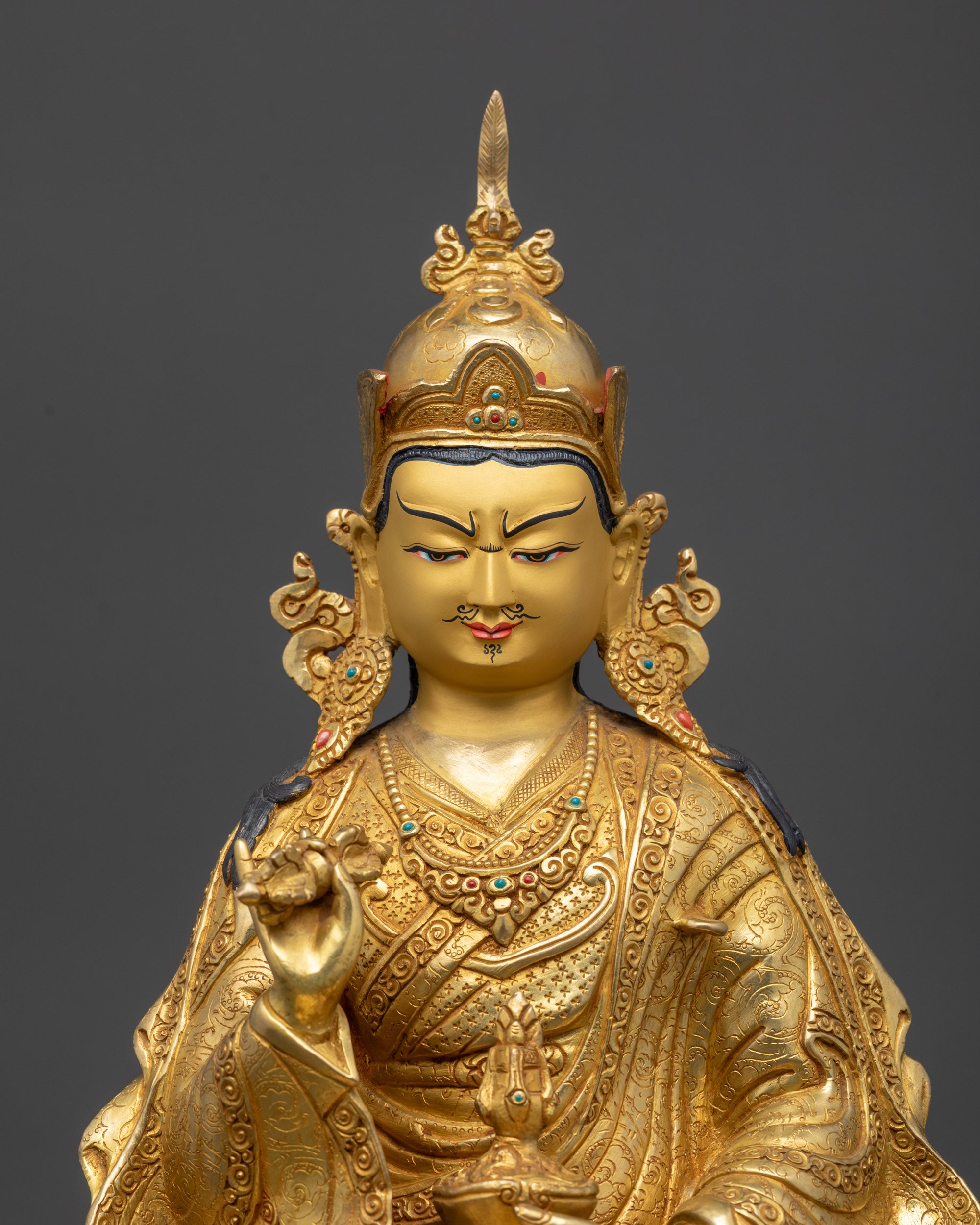 regular close up Tsokye Dorje statue showing engraved tantric robes and vajra symbolism