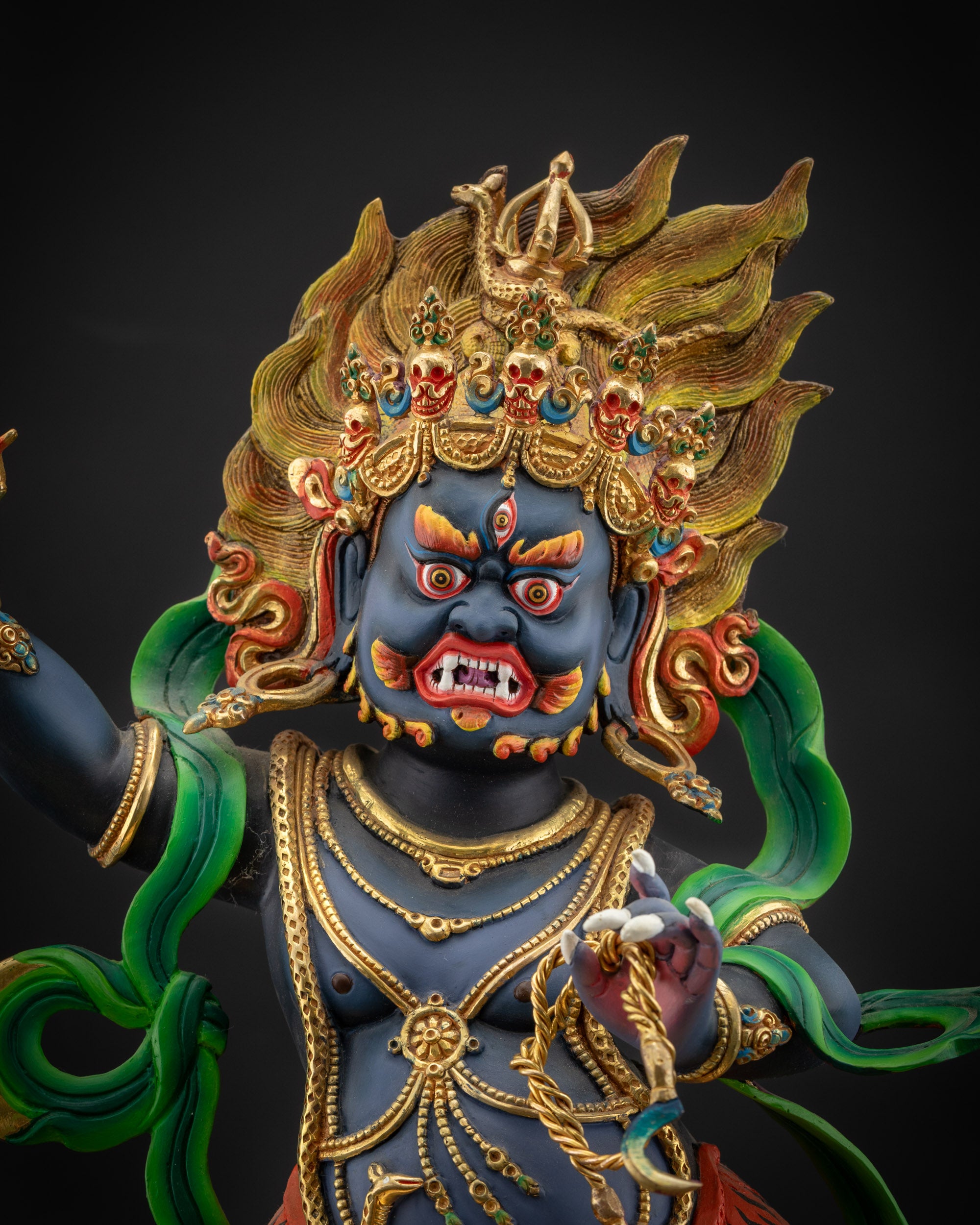 regular close up Vajrapani statue showing vivid blue skin and intricate details
