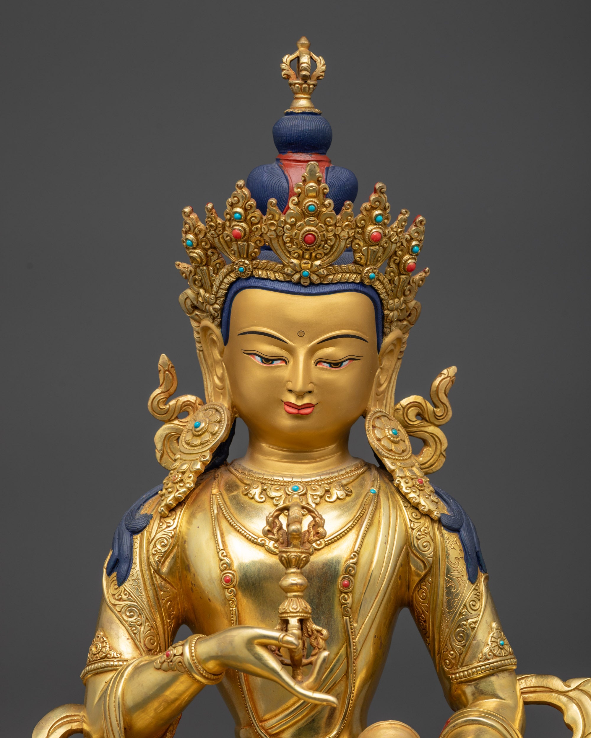 regular close up of Vajrasattva Statue showing flowing robe and semi-precious stones