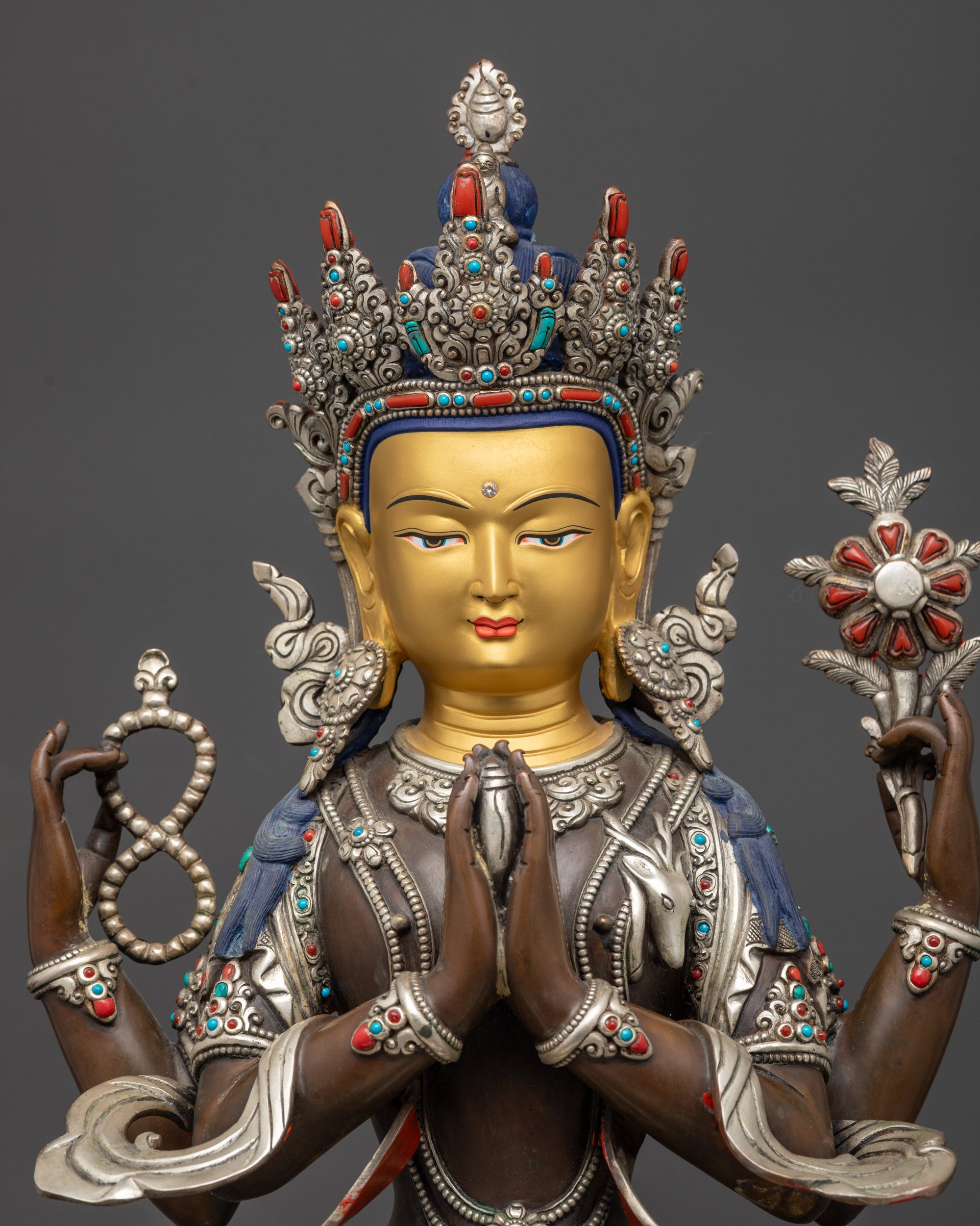 regular close up of oxidized Chenrezig Avalokiteshvara statue with semi-precious stone adornments