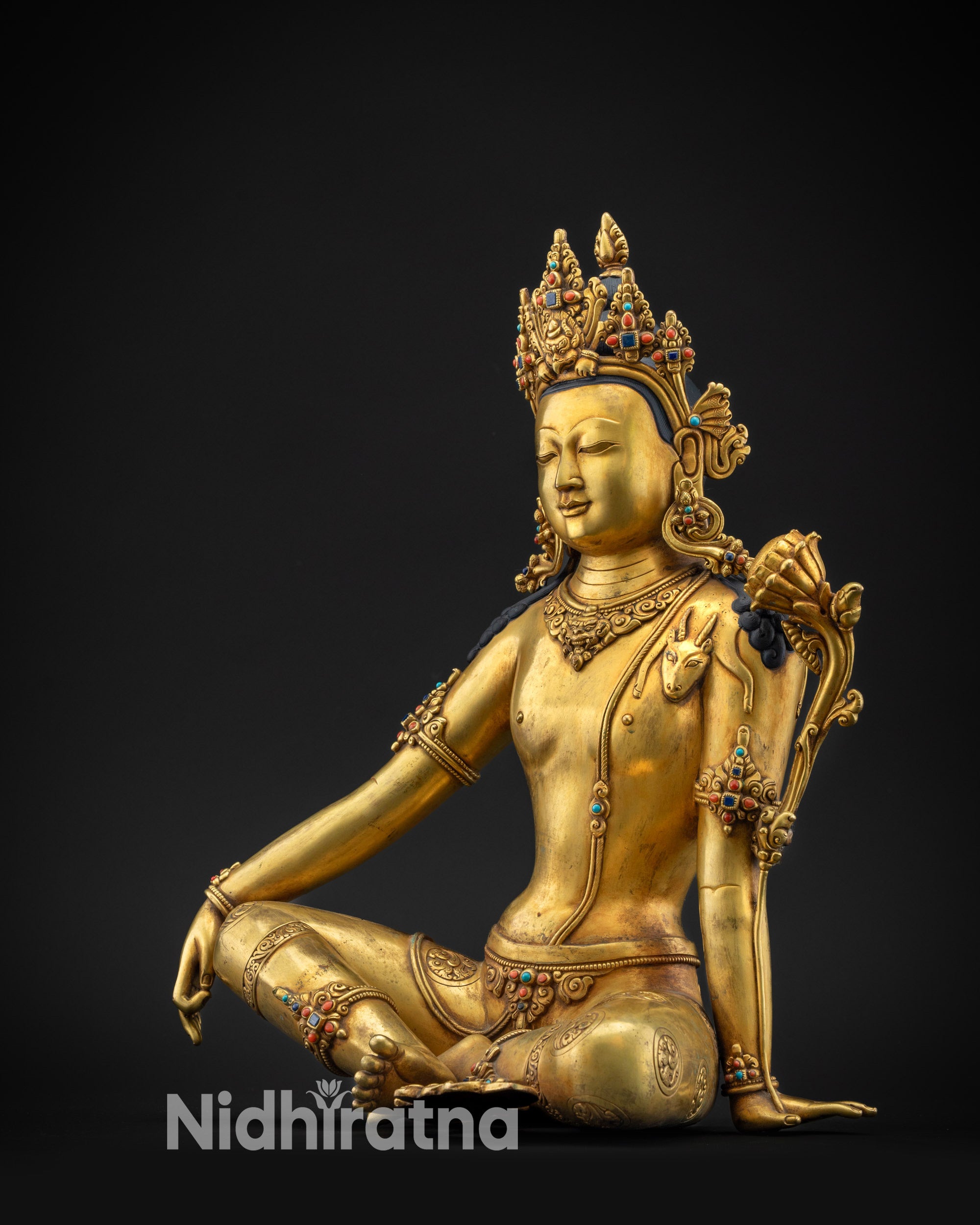 regular left side view chenrezig statue showing jeweled crown and carved garments