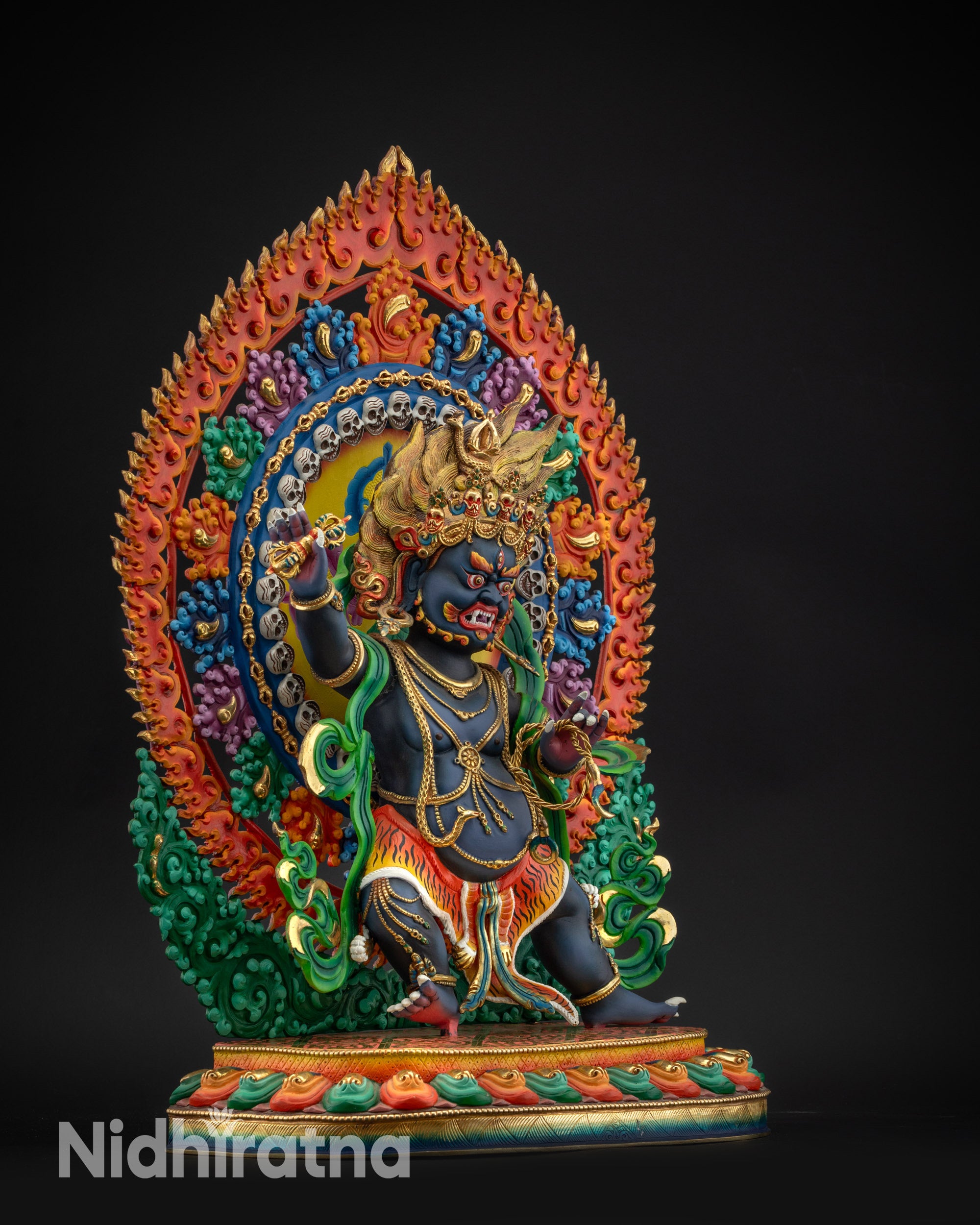 regular right side view Vajrapani statue showing swirling tiger-skin garment and serpent