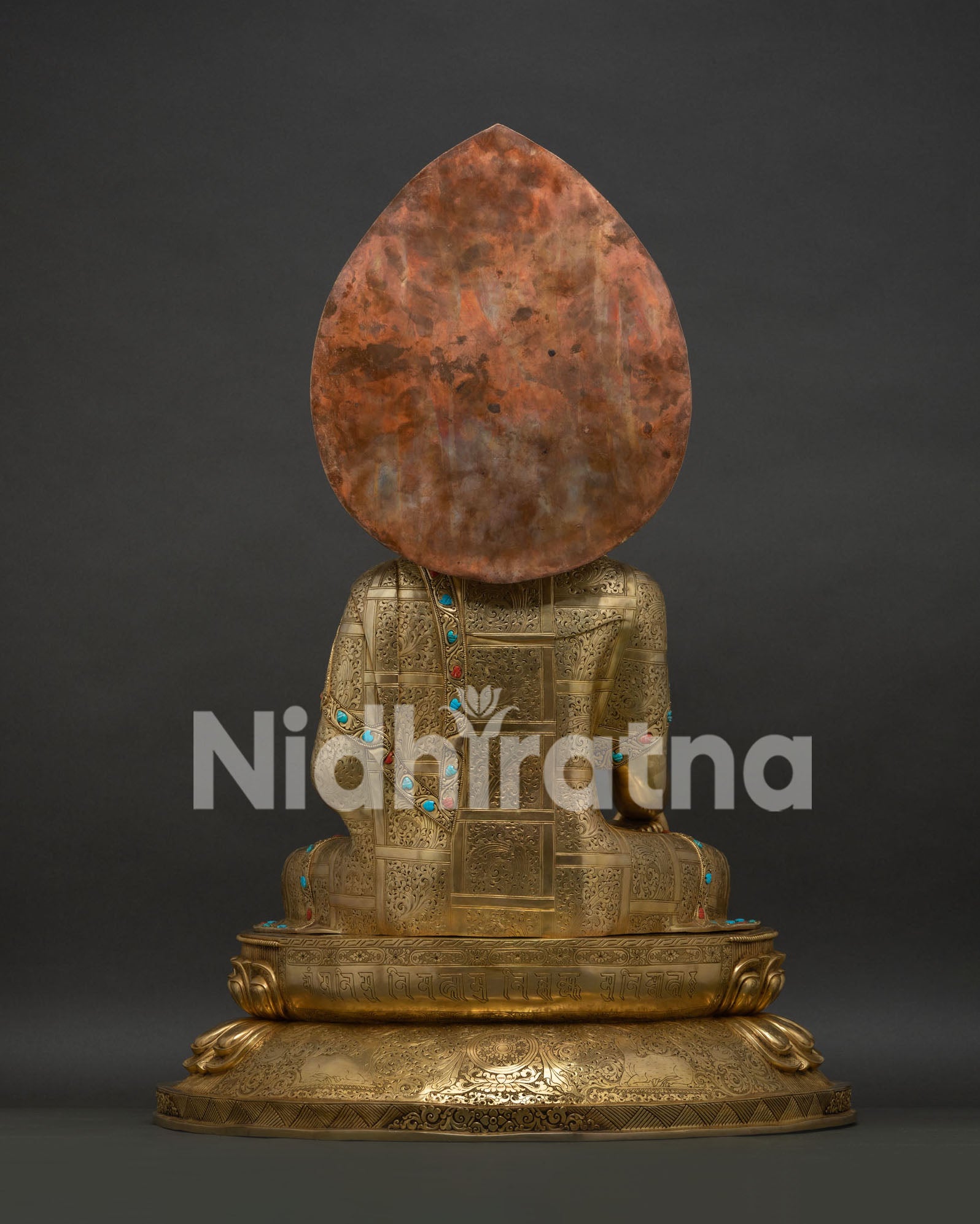 Reverse side of Buddha statue's flaming halo in polished copper