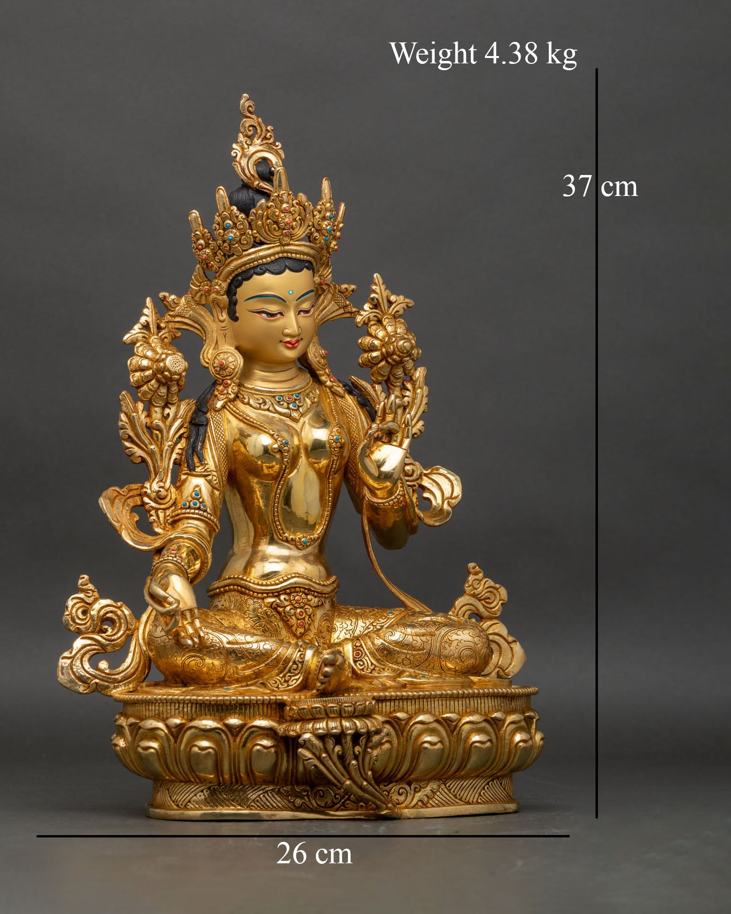Right profile of Green Tara statue in lalitasana posture on lotus throne