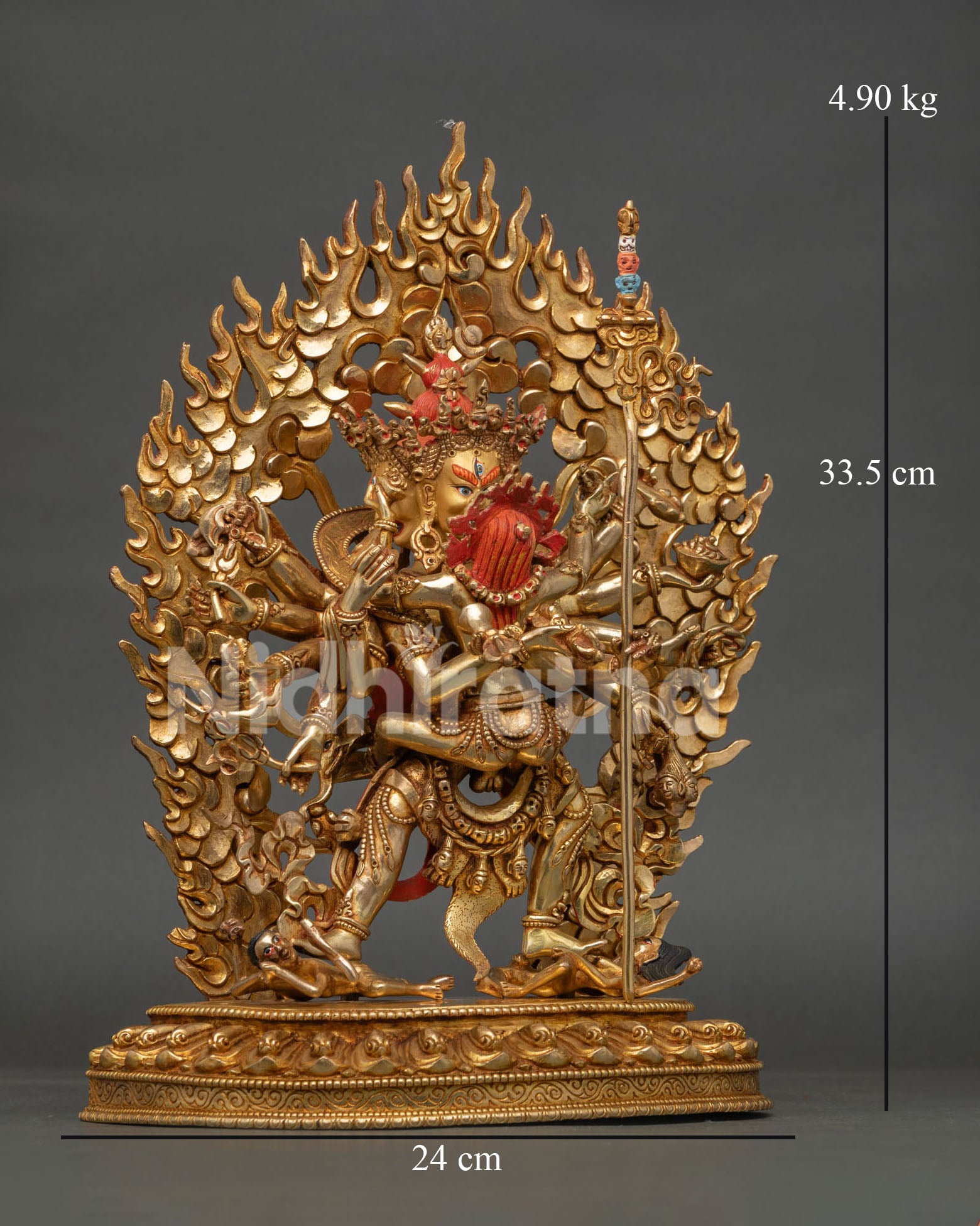 right profile of kalachakra statue with ornate halo and gold gilded finish