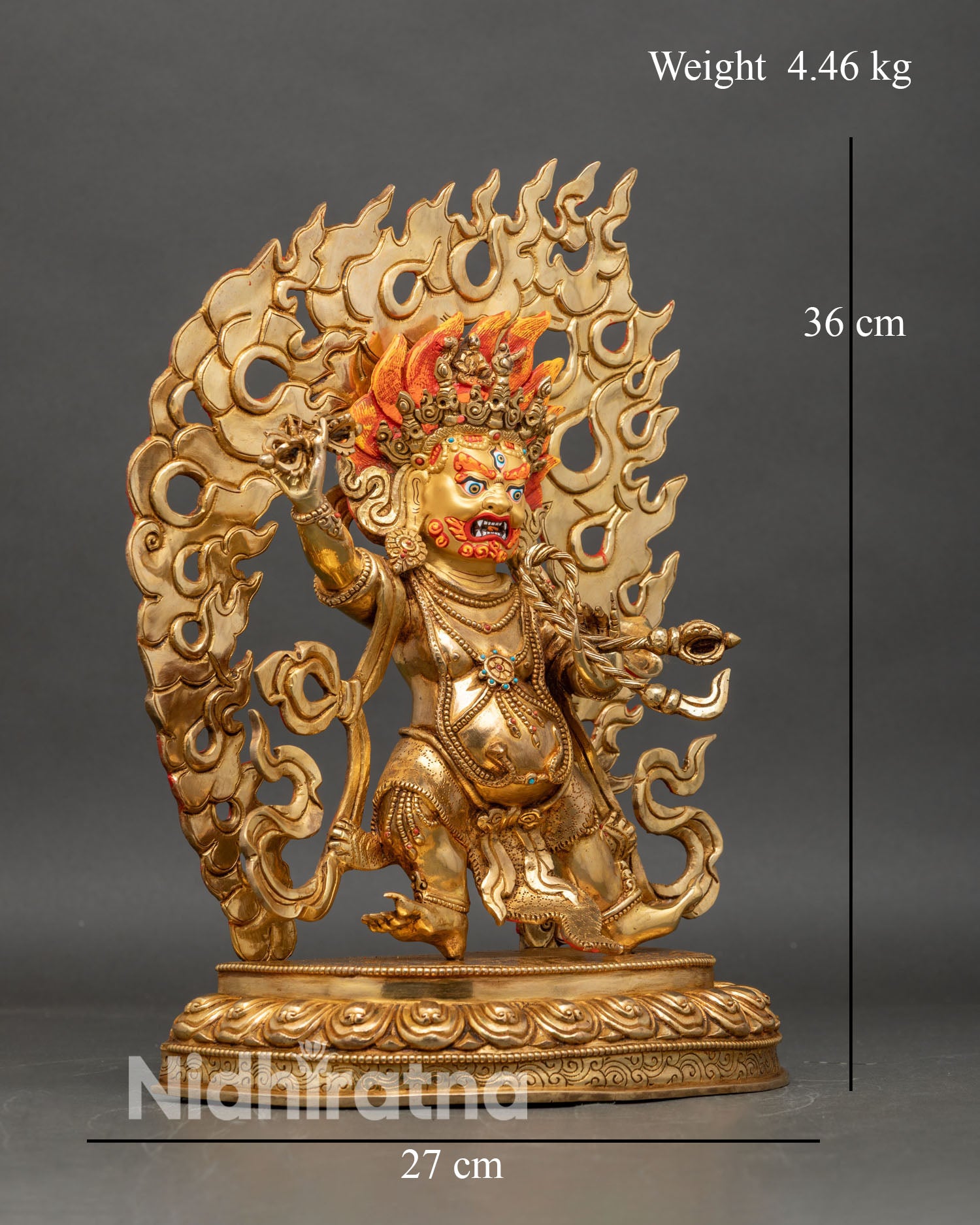 Right profile of Vajrapani statue with raised vajra and dynamic dancing posture
