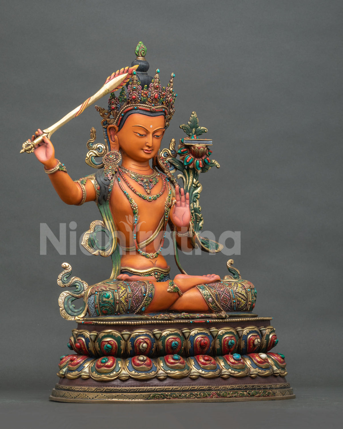 Right side view of handmade copper Manjushri Buddha Statue from Nepal