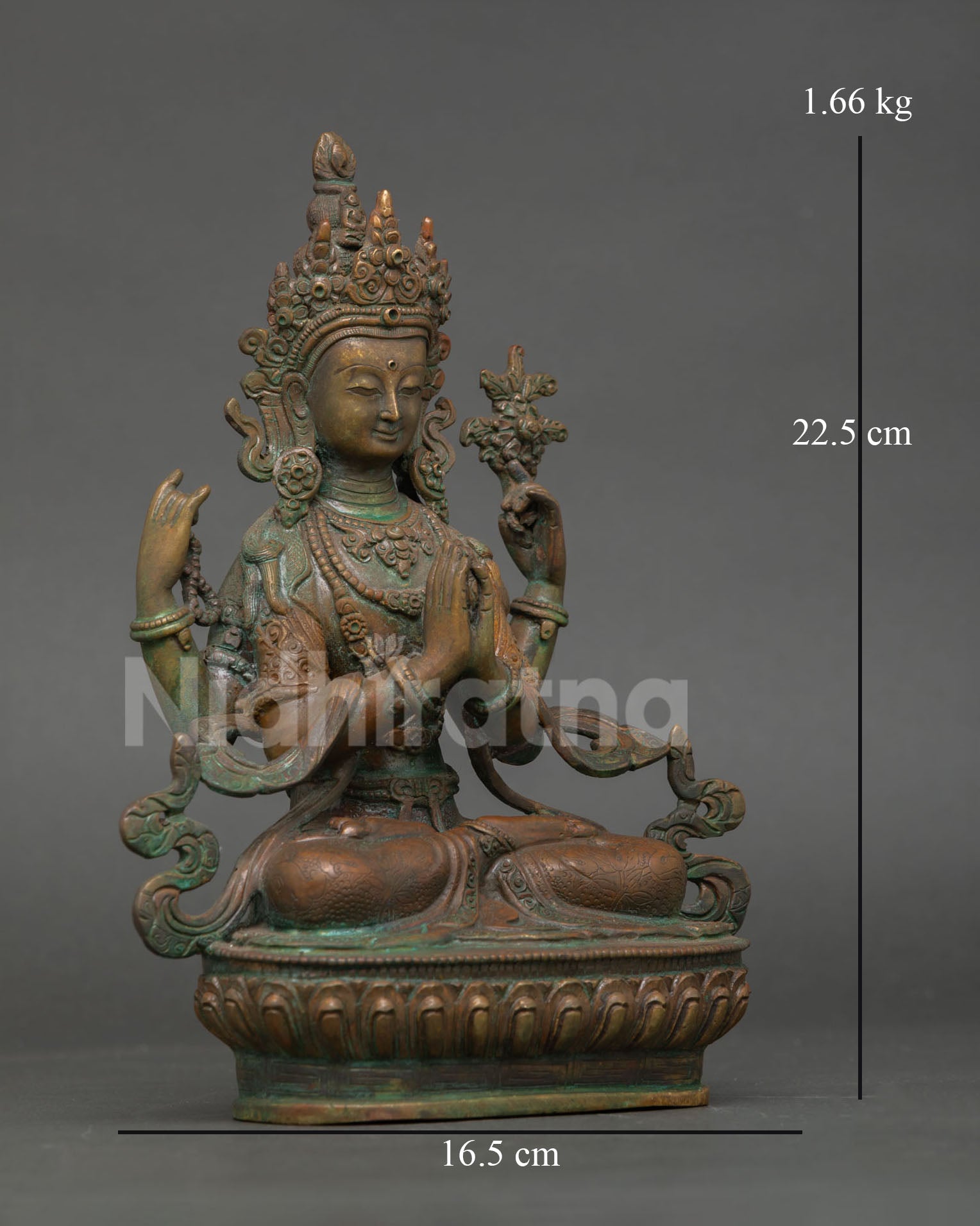 Right side view of Chenrezig Statue with utpala flowers and antique patina finish
