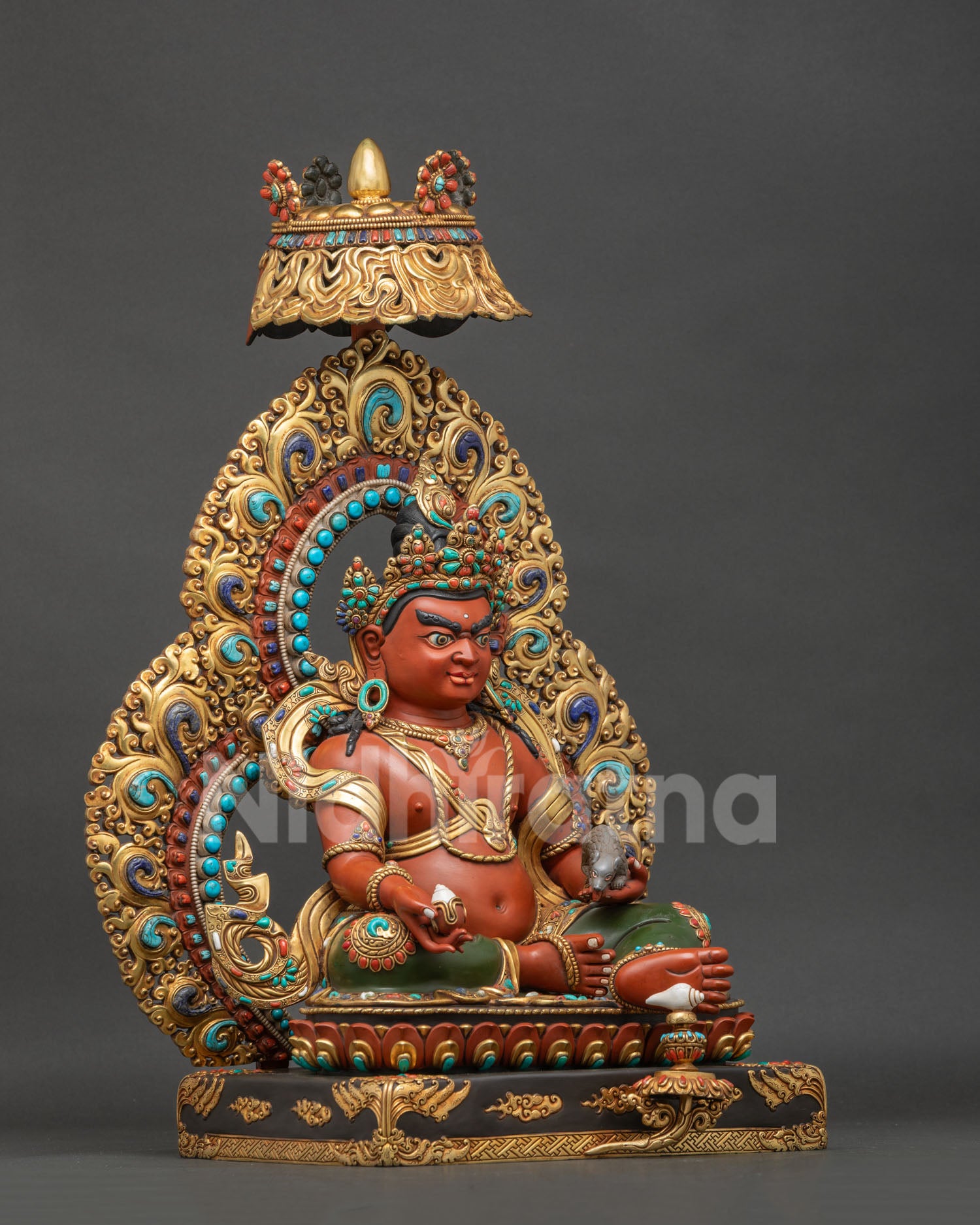 Right side view of Dzambhala Statue holding wish-fulfilling jewel and jeweled mongoose