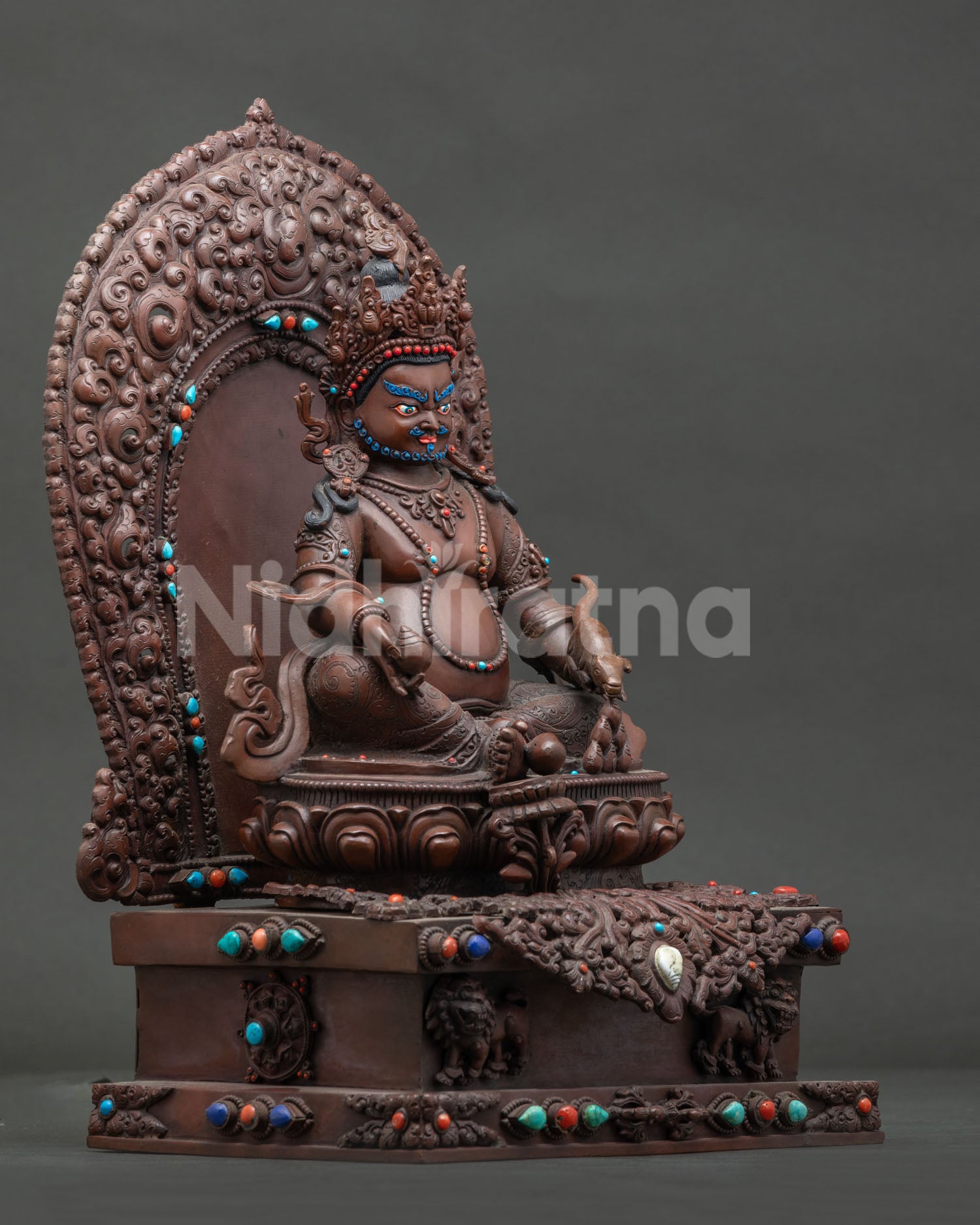 Right side view of Enthroned Dzambhala Statue, oxidized copper Himalayan sculpture