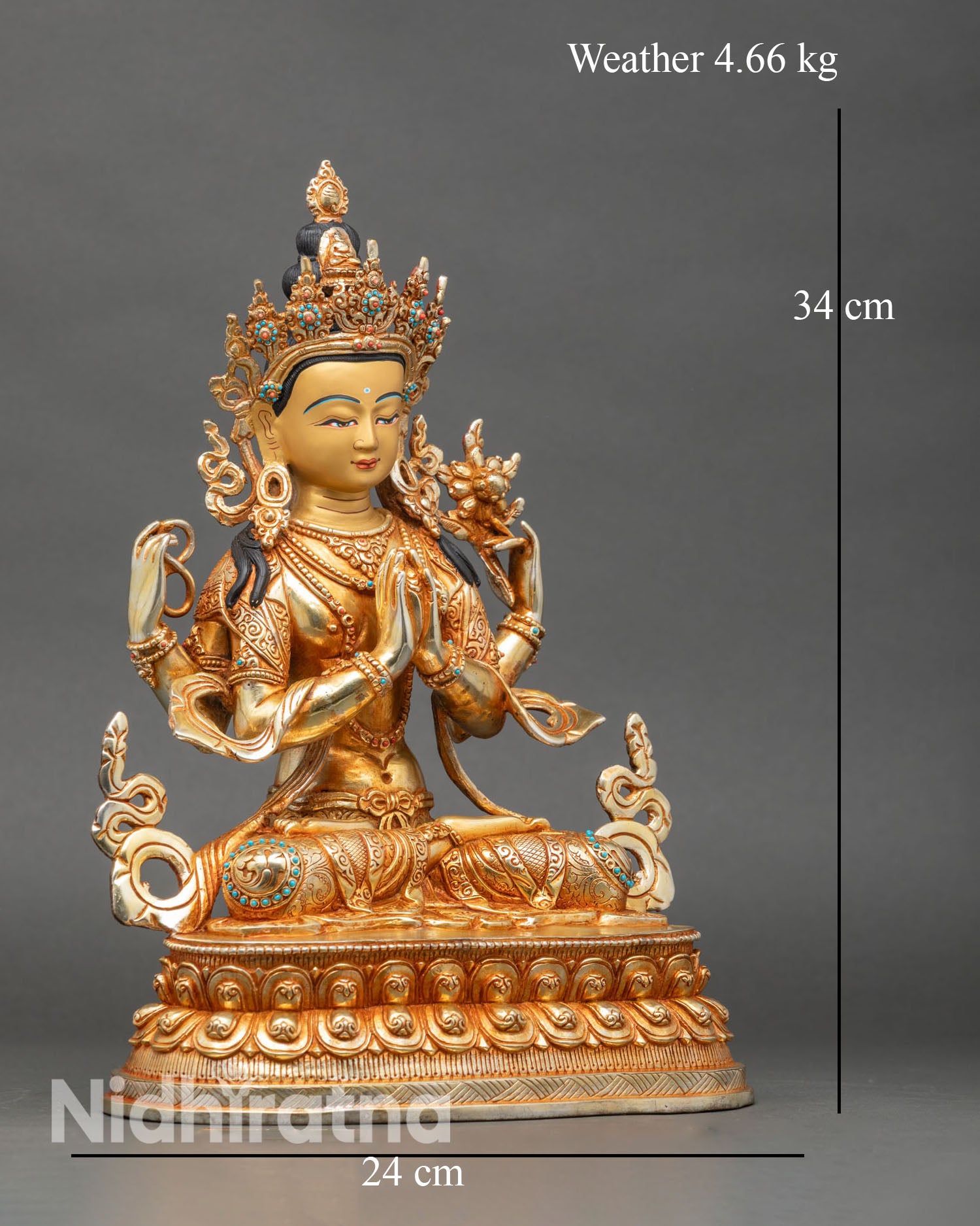 Right side view of four-armed Avalokiteshvara statue with lotus, mala, and jeweled ornaments
