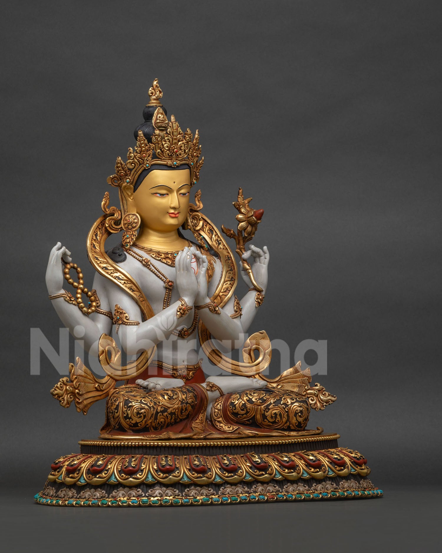 Right side view of Four-Armed Chenrezig statue with copper and gold-gilded details