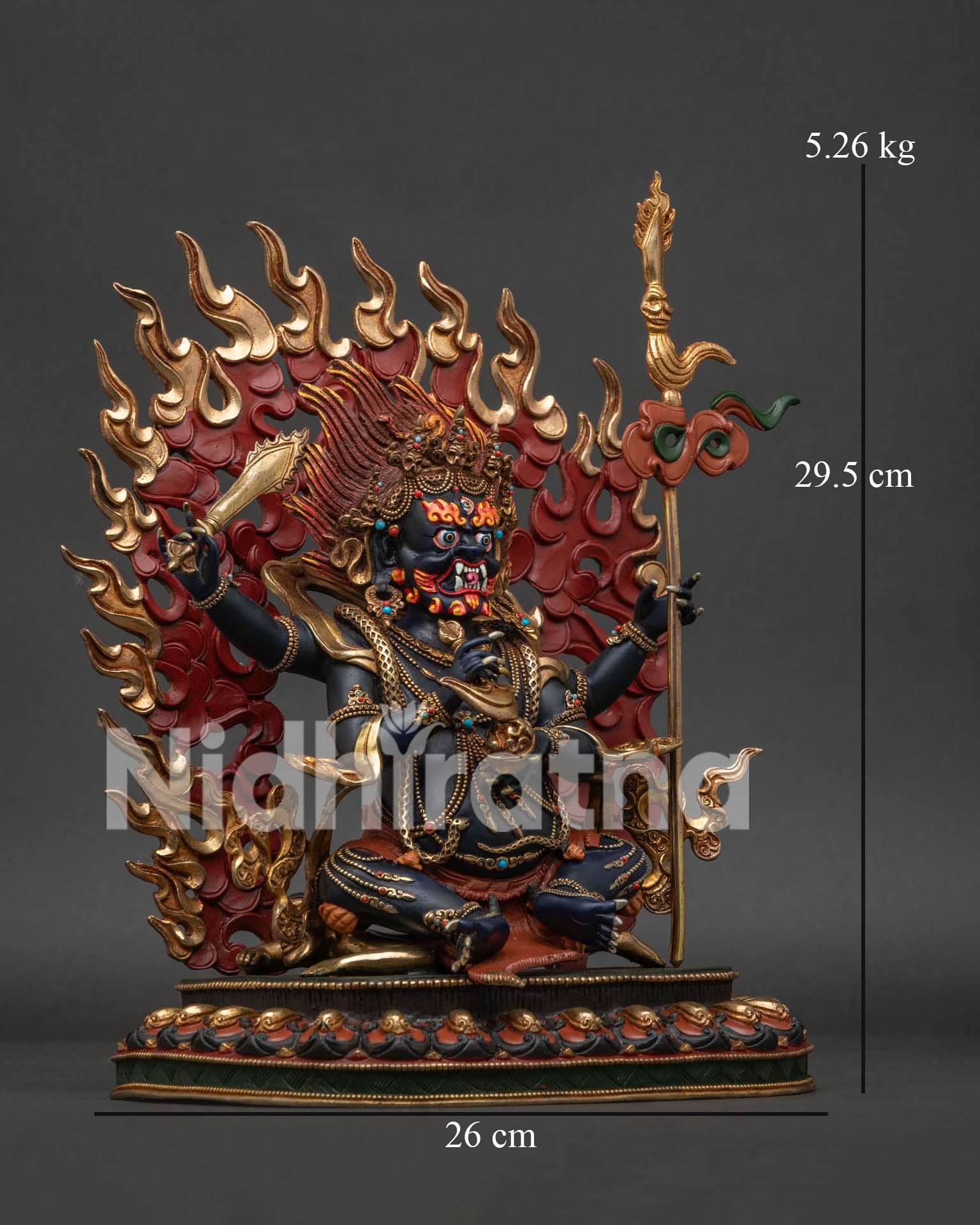 Right side view of Four Armed Mahakala statue in gold gilded copper