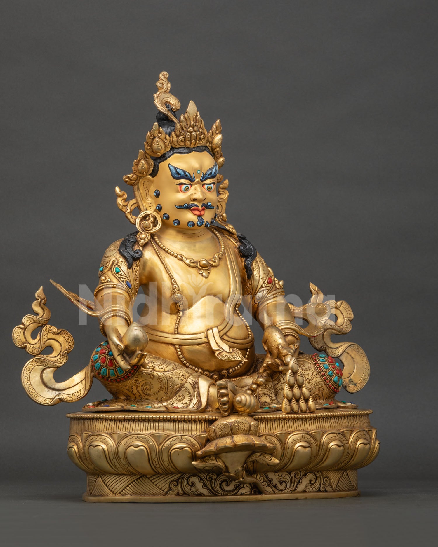 Right side view of gold-gilded copper Dzambhala statue, Buddhist wealth deity