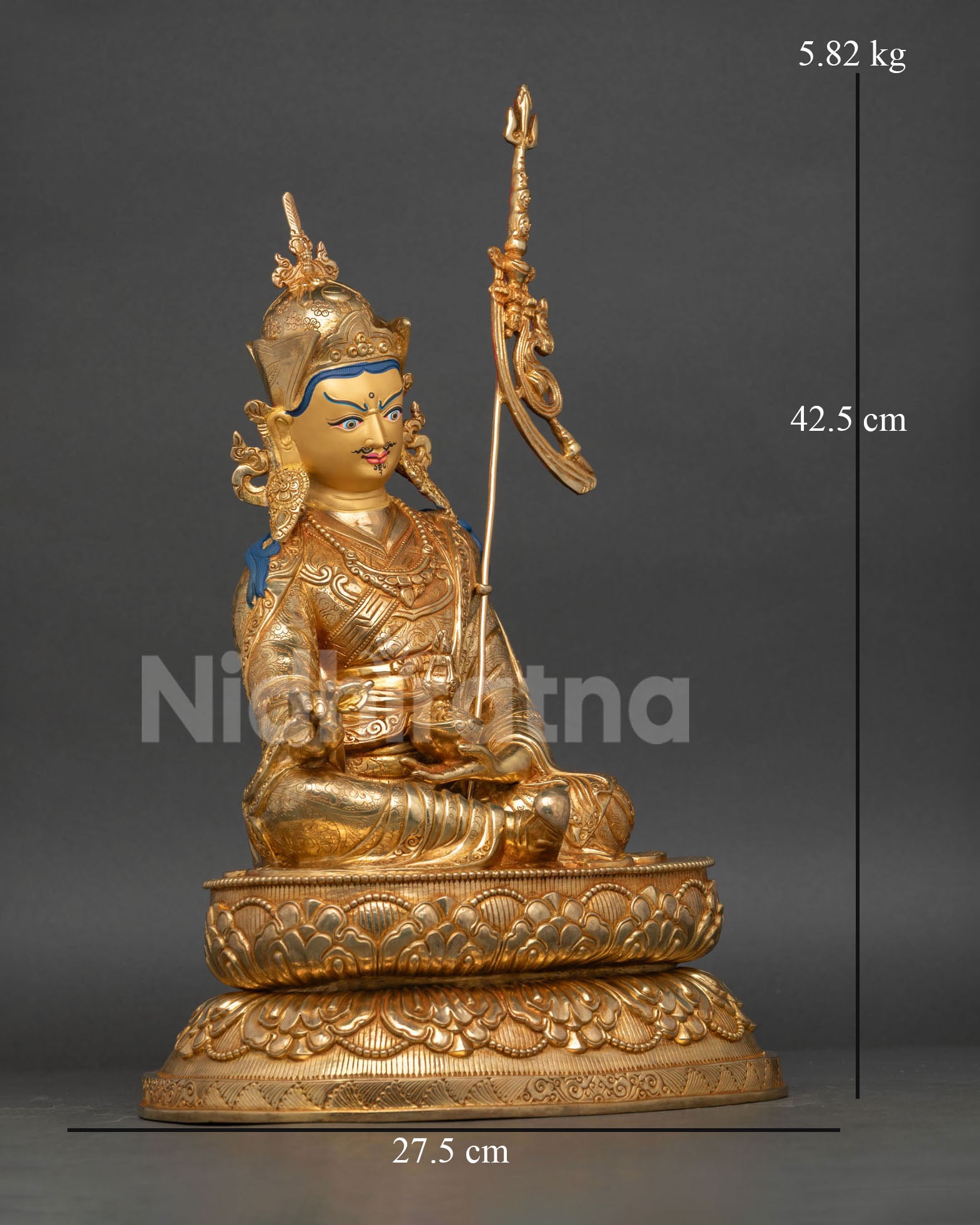 Right-side view of Guru Rinpoche statue with khatvanga trident and gold-gilded copper body