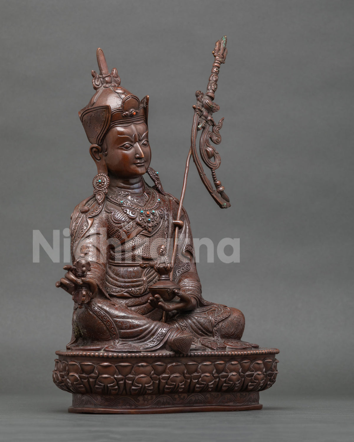 Right side view of handcrafted oxidized copper Guru Rinpoche statue, Padmasambhava from Nepal