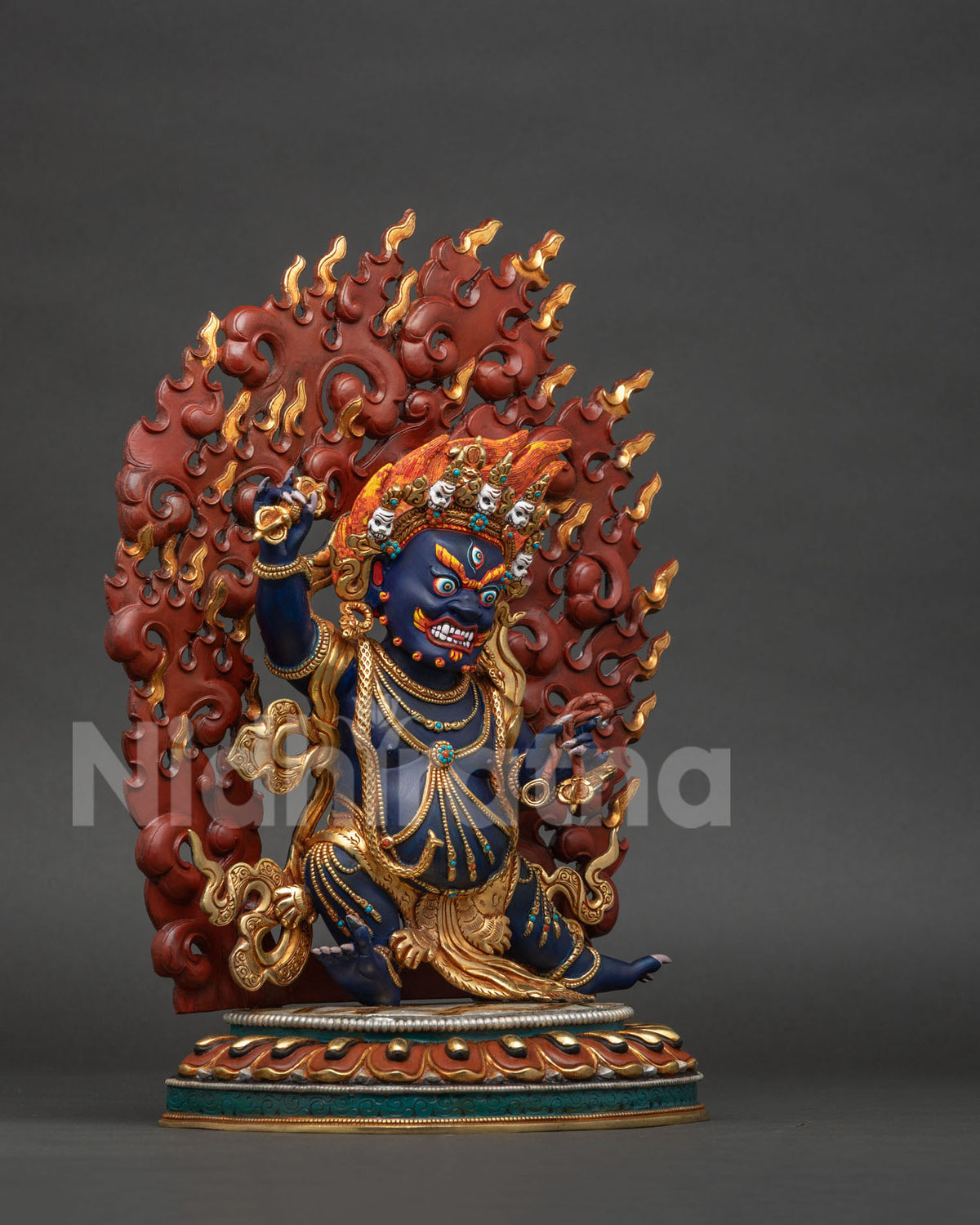 Right side view of handcrafted Vajrapani statue with vajra, robes and ornate details