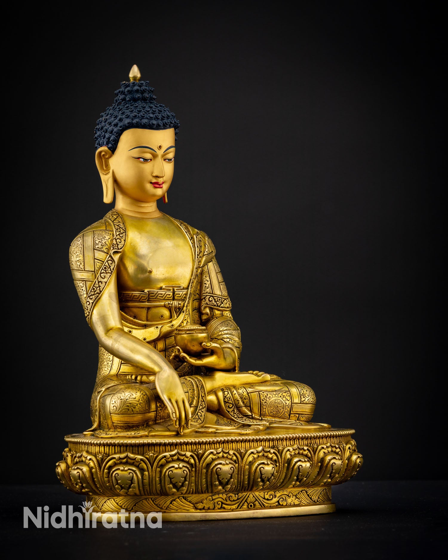 Right side view of handmade Shakyamuni Buddha sculpture with polished gold gilded robe details