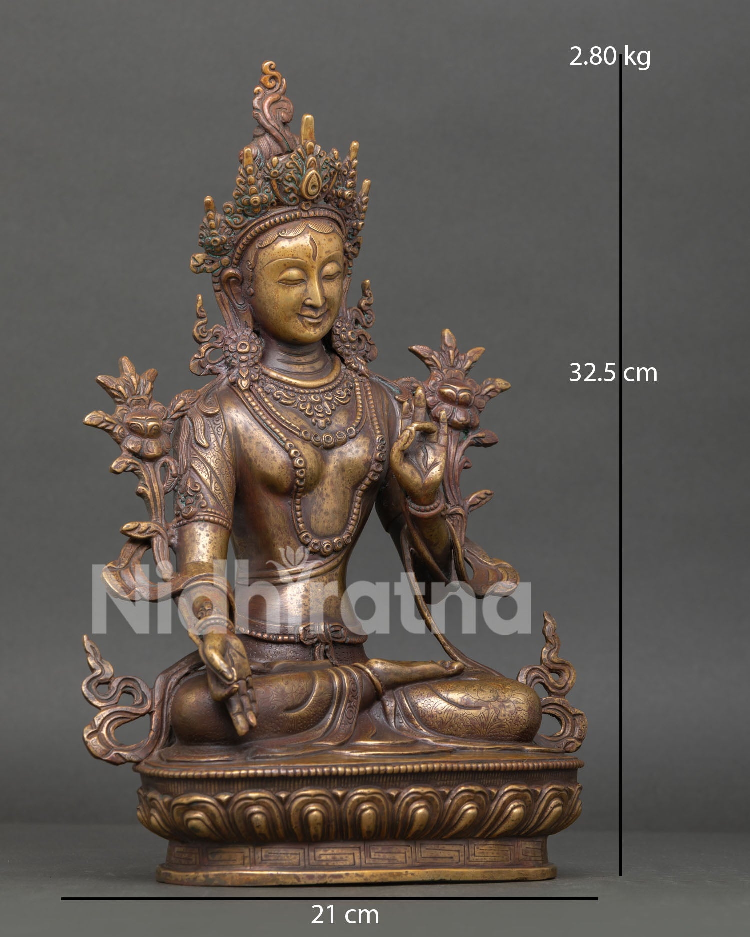 Right side view of handmade White Tara statue with antique finish and lotus pedestal