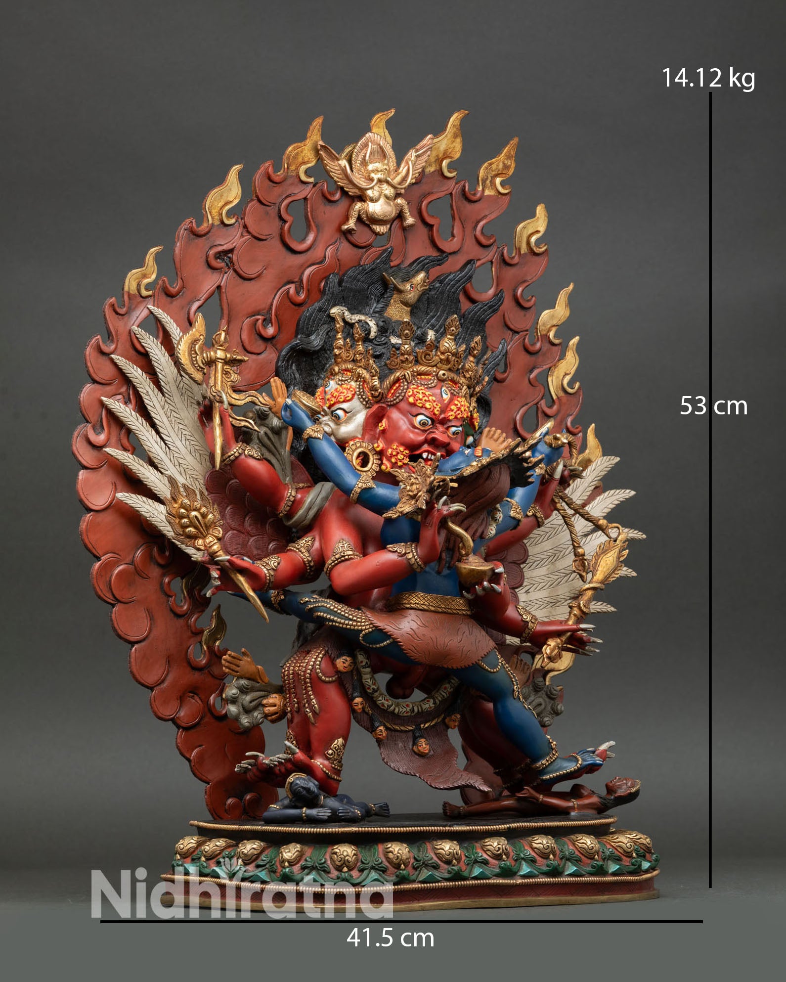 right side view of hayagriva statue in yab yum posture with multiple arms and ritual items