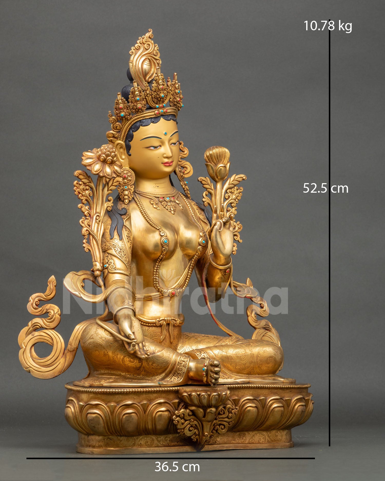 Right-side view of large Green Tara statue with utpala flower and fire-gilded copper body