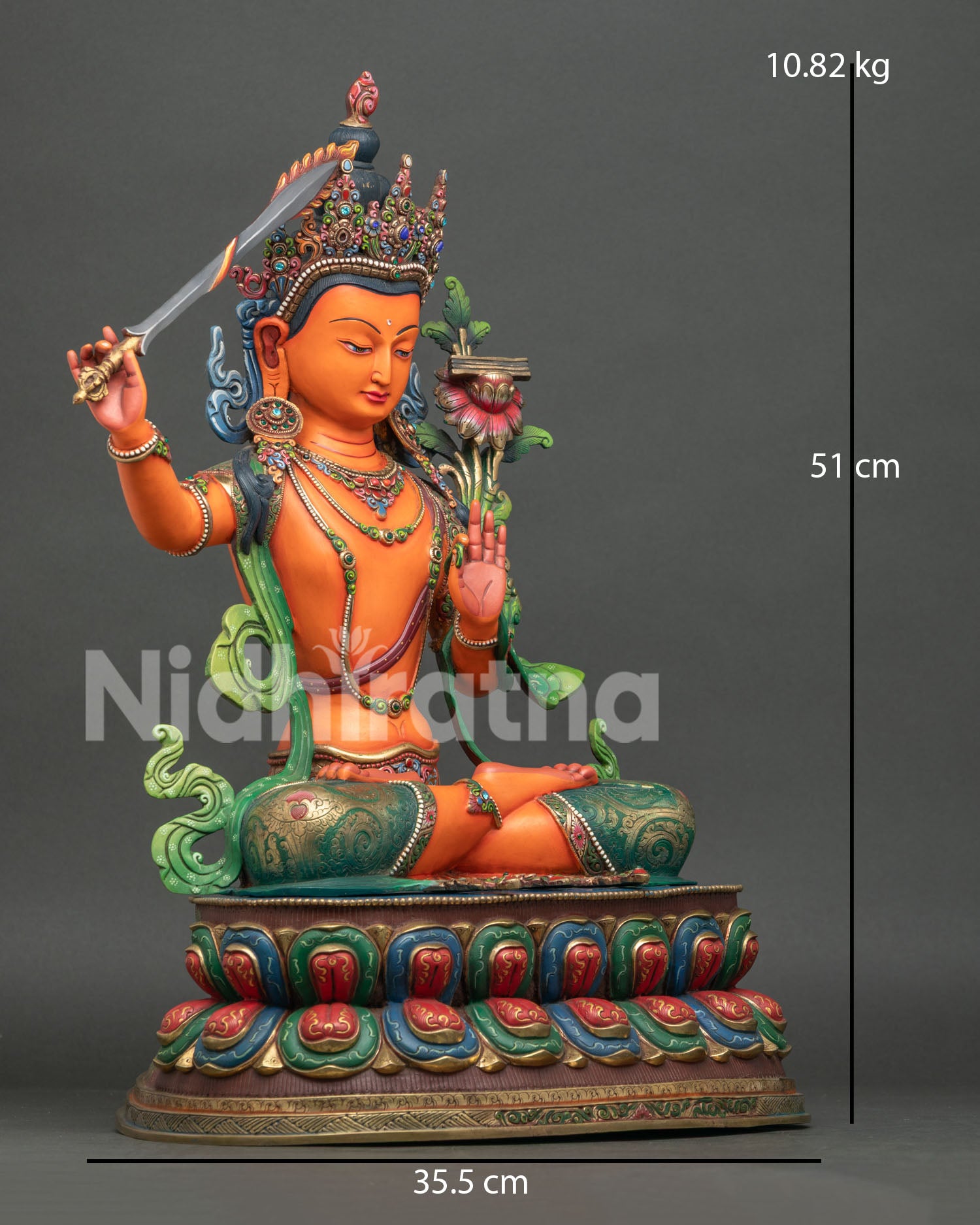 Right side view of Large Manjushri statue with flaming wisdom sword and lotus