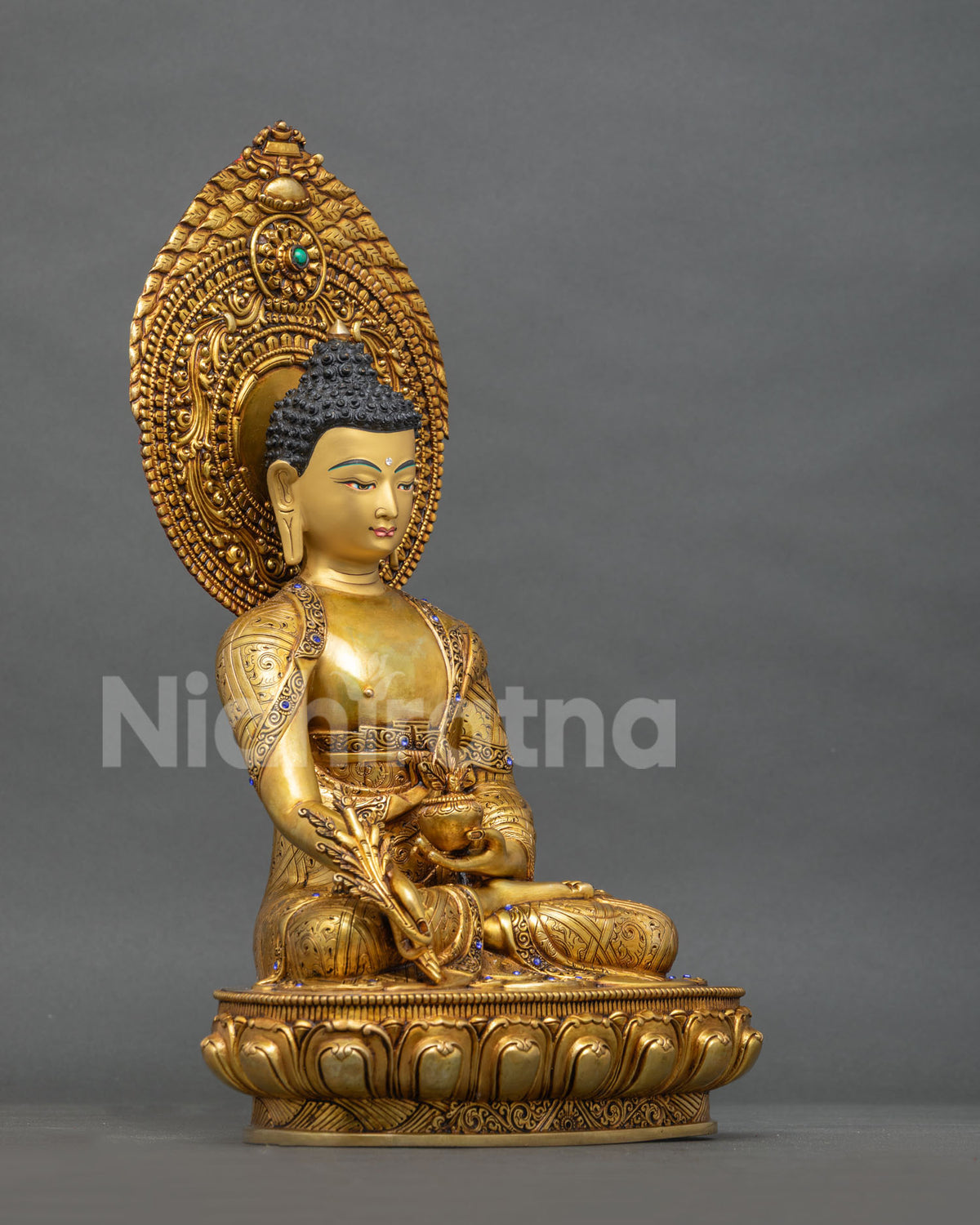 Right side view of Medicine Buddha statue, gold fire-gilded copper Bhaishajyaguru idol from Nepal