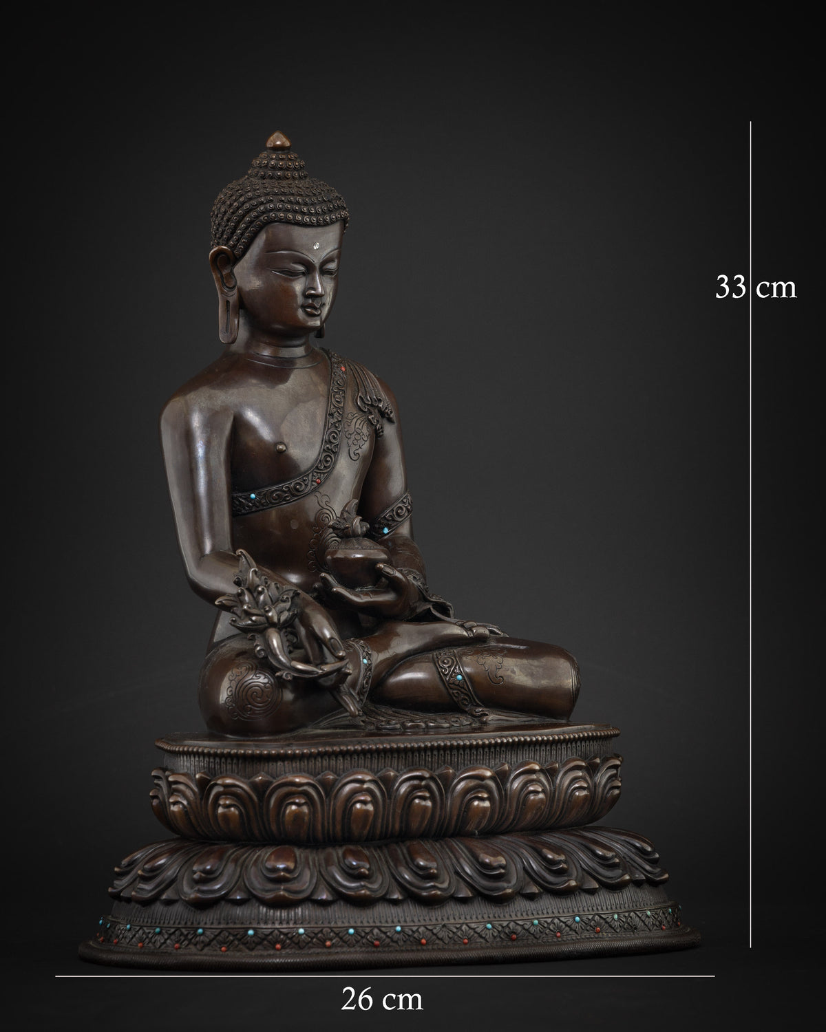Right side view of Medicine Buddha statue holding myrobalan plant, lost wax cast copper sculpture