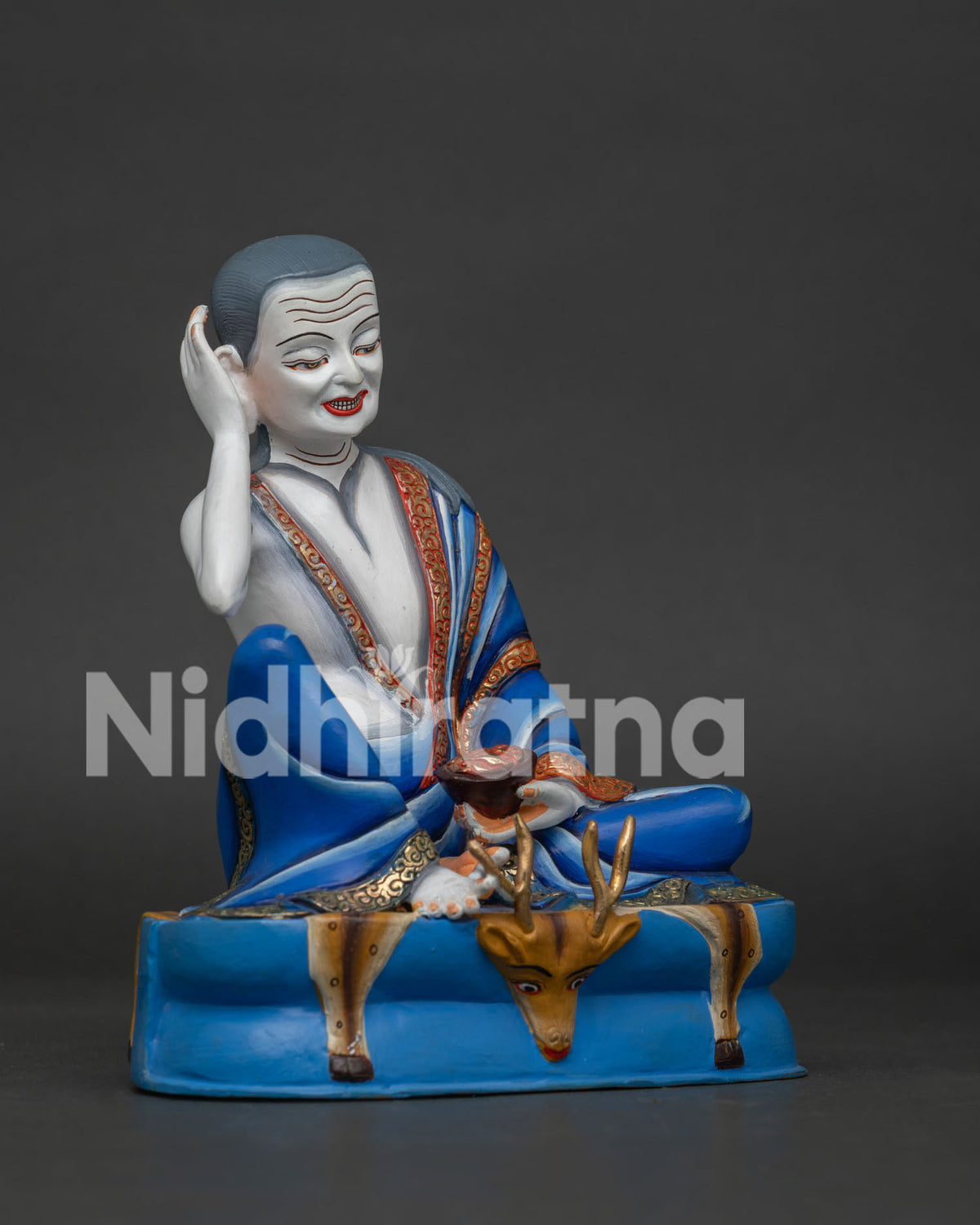 Right side view of Milarepa statue, handcrafted copper Tibetan yogi seated on a deer skin