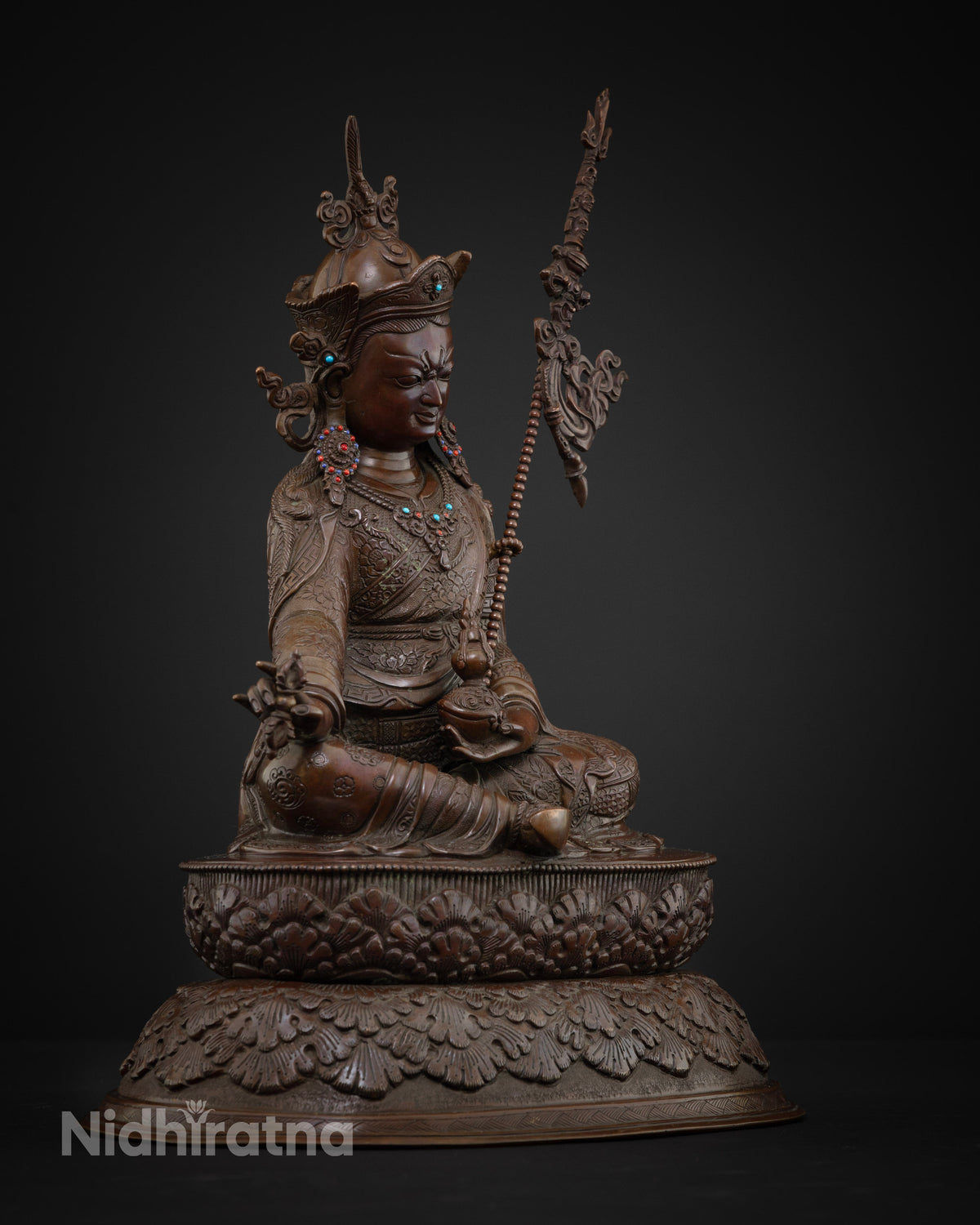 Right side view of oxidized copper Guru Rinpoche statue on double lotus pedestal, handmade in Nepal