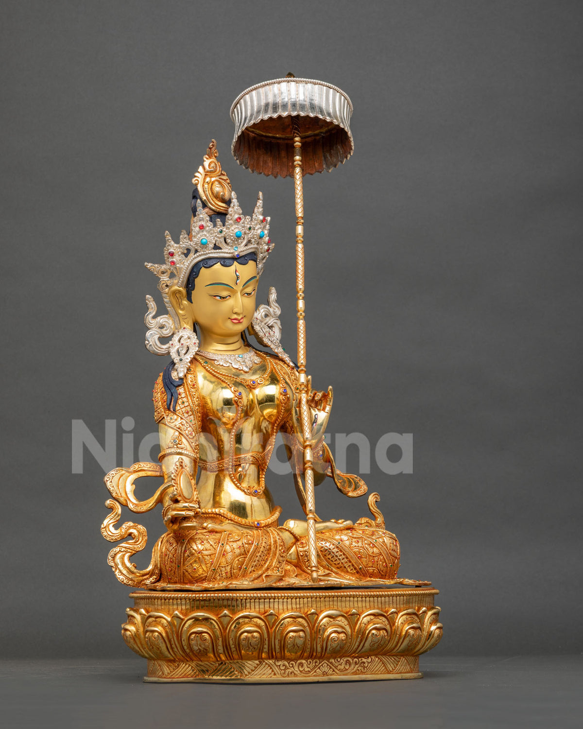 Right side view of Sitatapatra Dukar Statue with silver parasol and lotus pedestal, Nepal