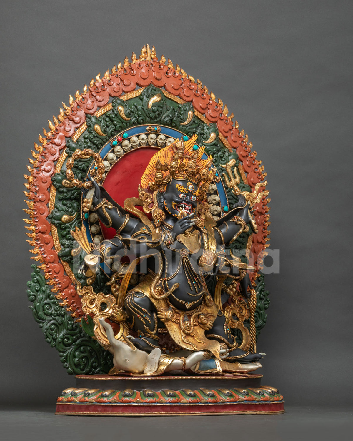 Right side view of Six-Armed Black Mahakala Statue with flaming halo and tiger-skin garment