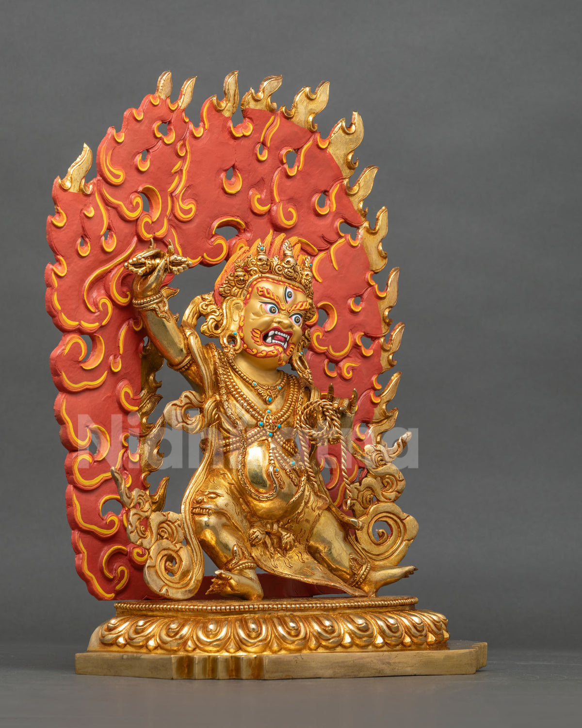 Right side view of Tibetan Vajrapani statue with blazing halo on lotus base, handcrafted in Nepal