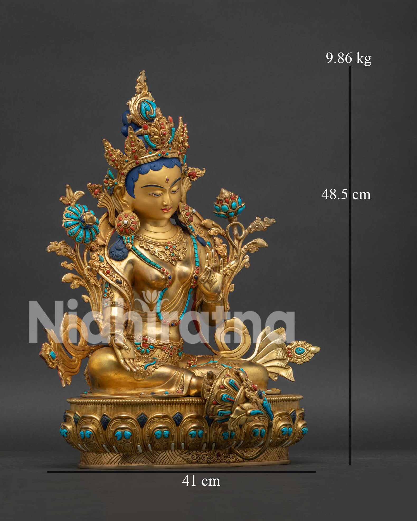 Right view of copper Green Tara statue showing extended leg and right hand in varada mudra.