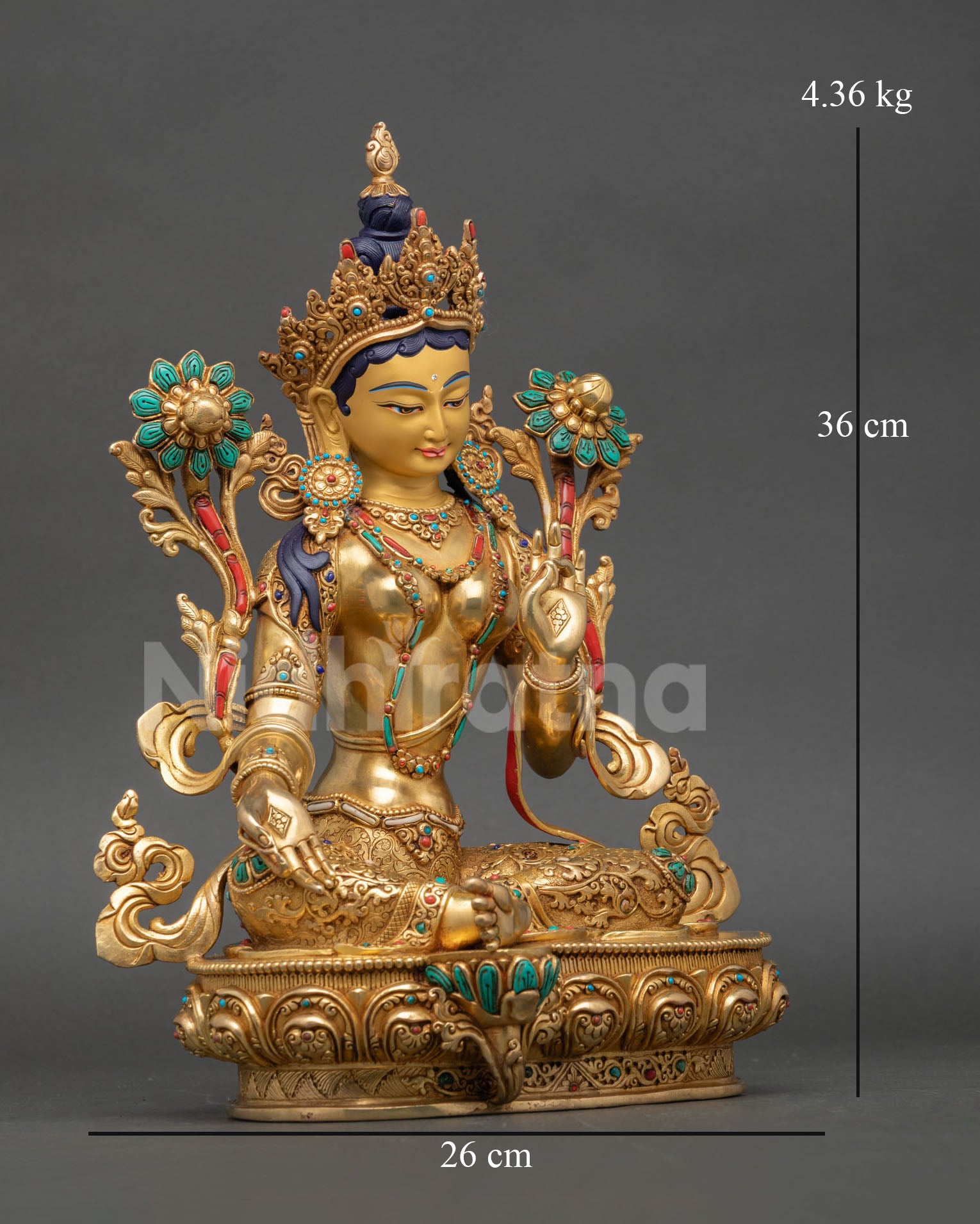 Right view of Green Tara Statue with lotus flowers and sacred ornaments
