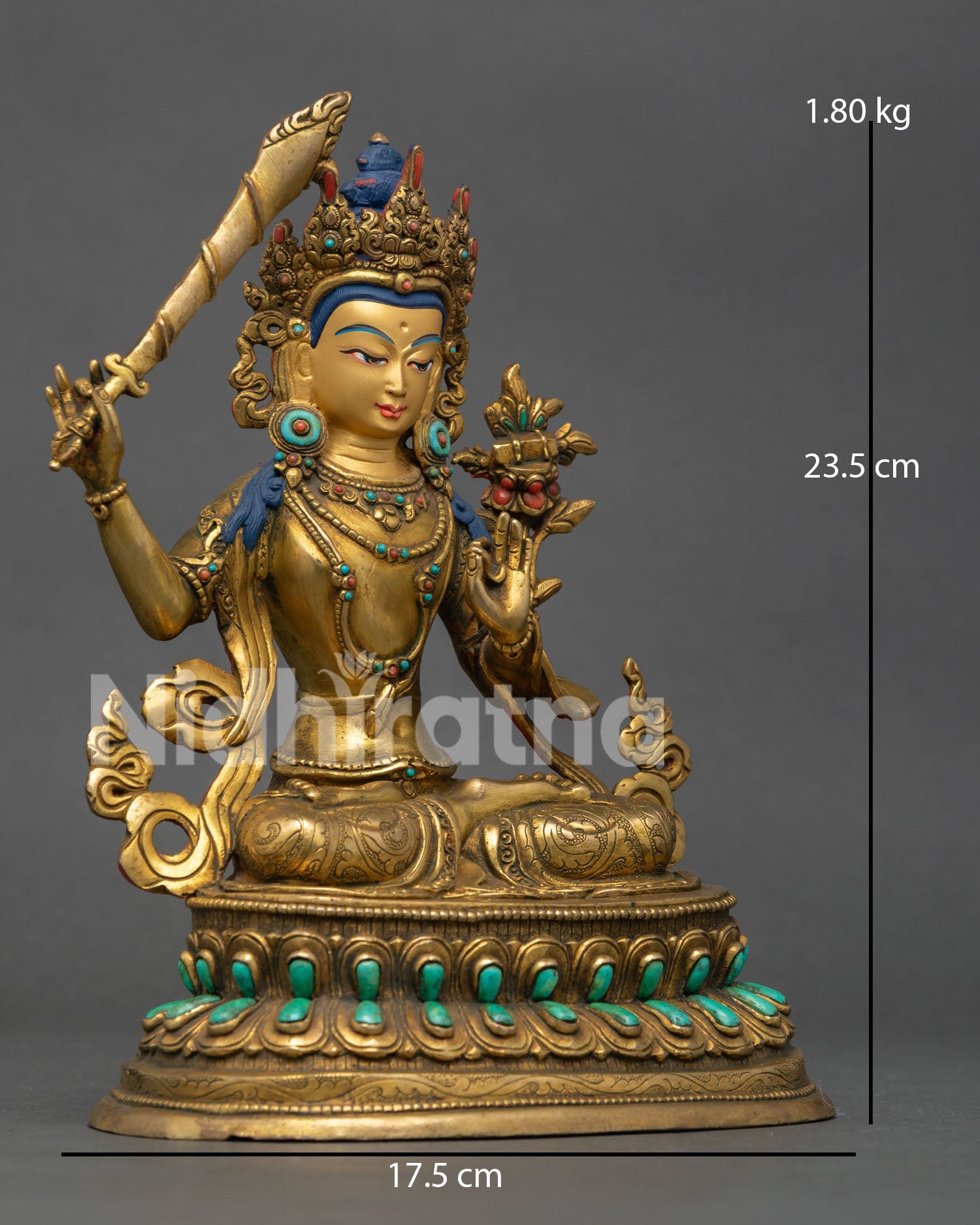 right view of manjushri statue holding flaming wisdom sword on lotus throne