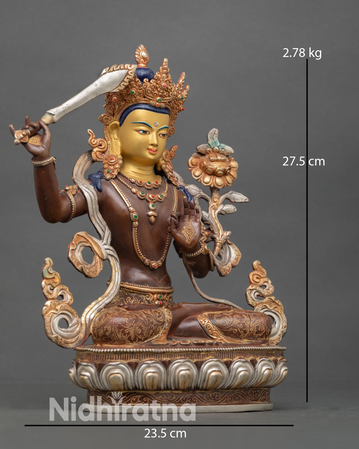 right view of oxidized copper manjushri statue with flaming wisdom sword