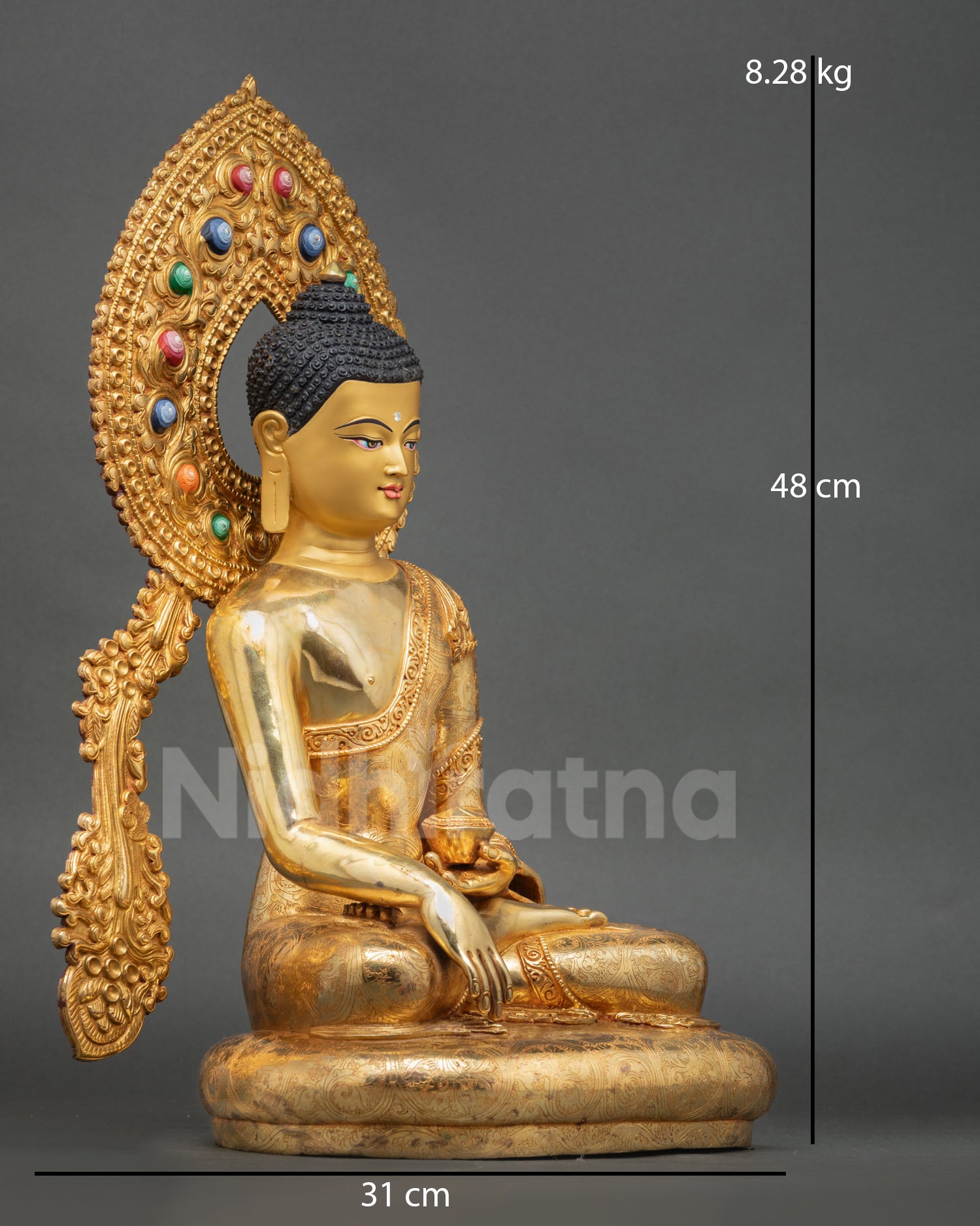 right view of Shakyamuni Buddha statue with lotus pedestal and sacred alms bowl