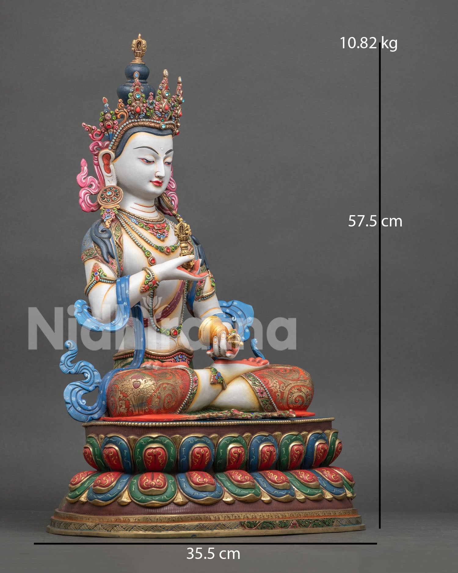 right view of vajrasattva buddhist statue with flowing robes and lotus pedestal
