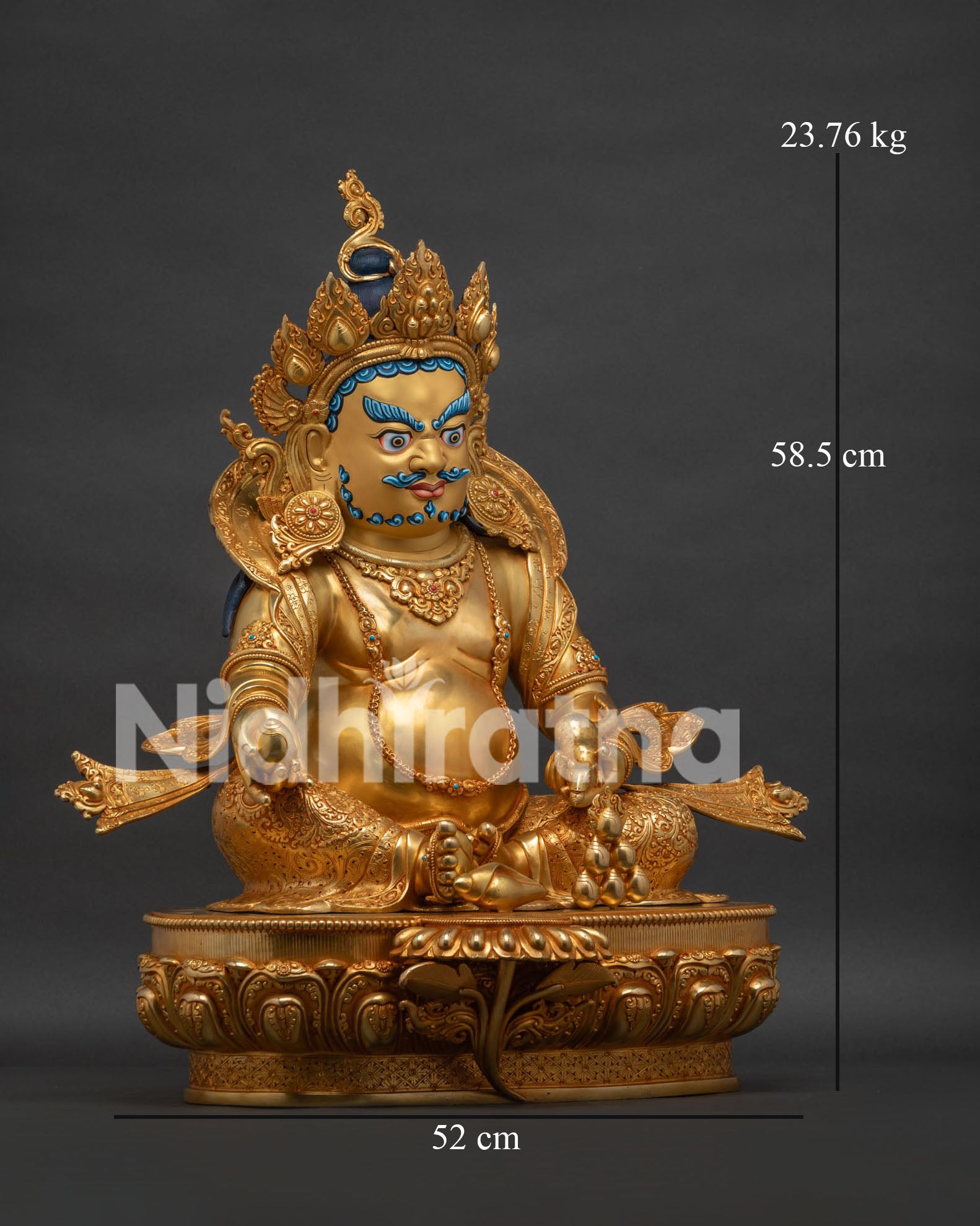 Right view side of Dzambhala statue showing gold gilded robe patterns and mongoose symbolism