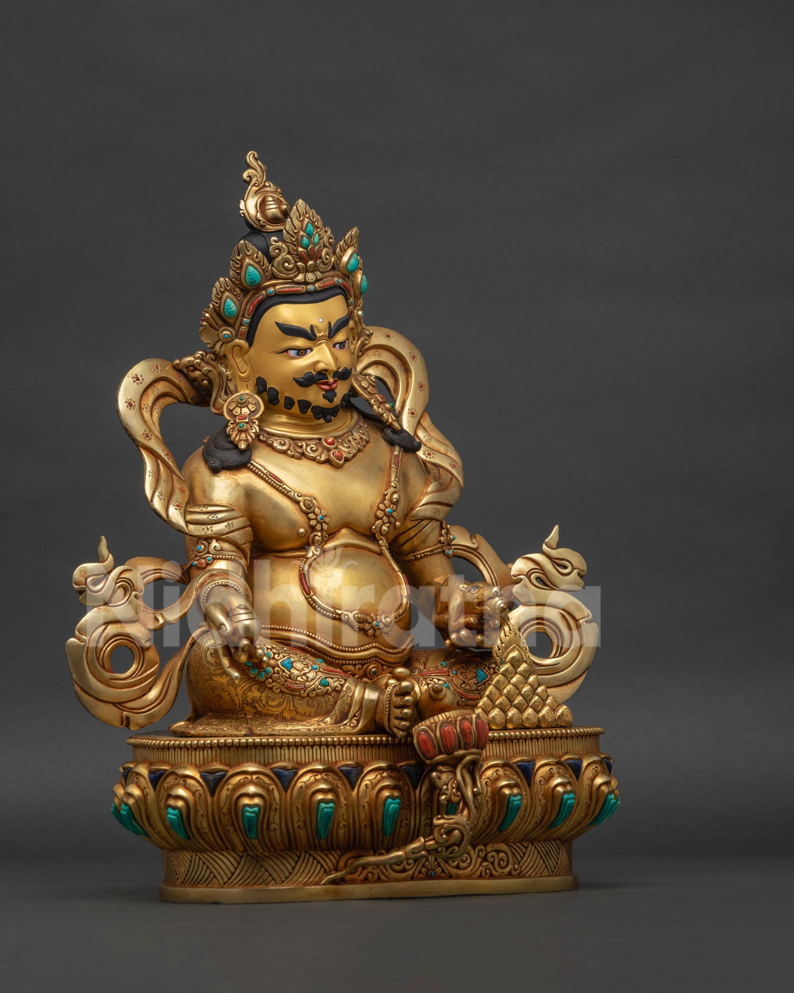 right view side of handcrafted dzambhala statue with gold gilding and gemstones