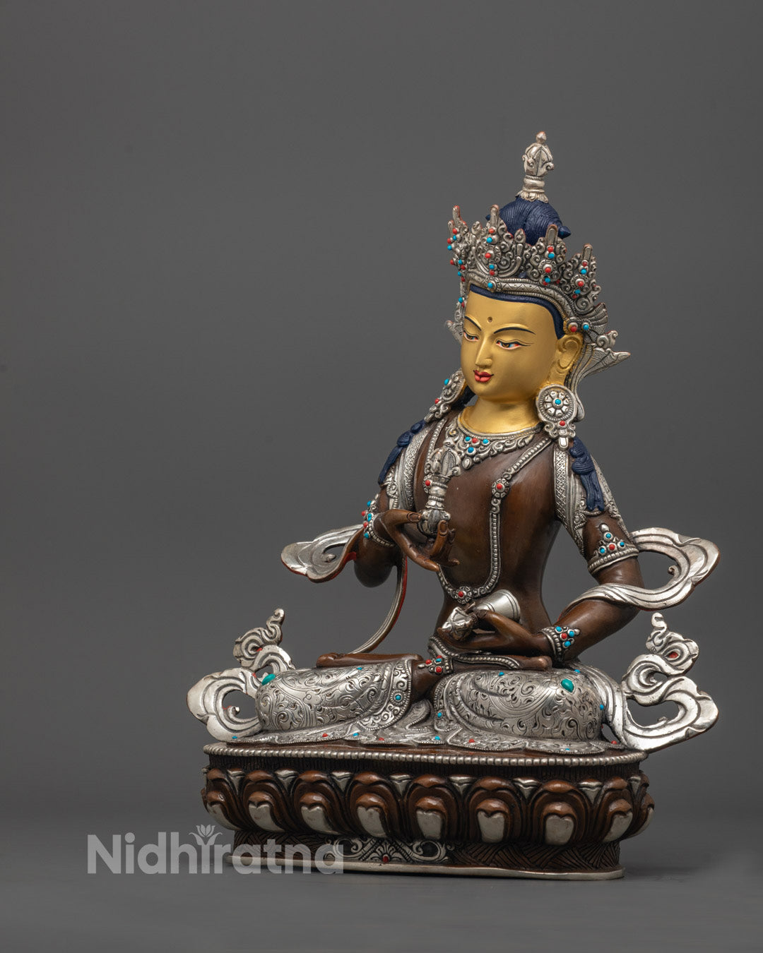 right angle of Vajrasattva holding nectar vase, seated in dhyana mudra on lotus base
