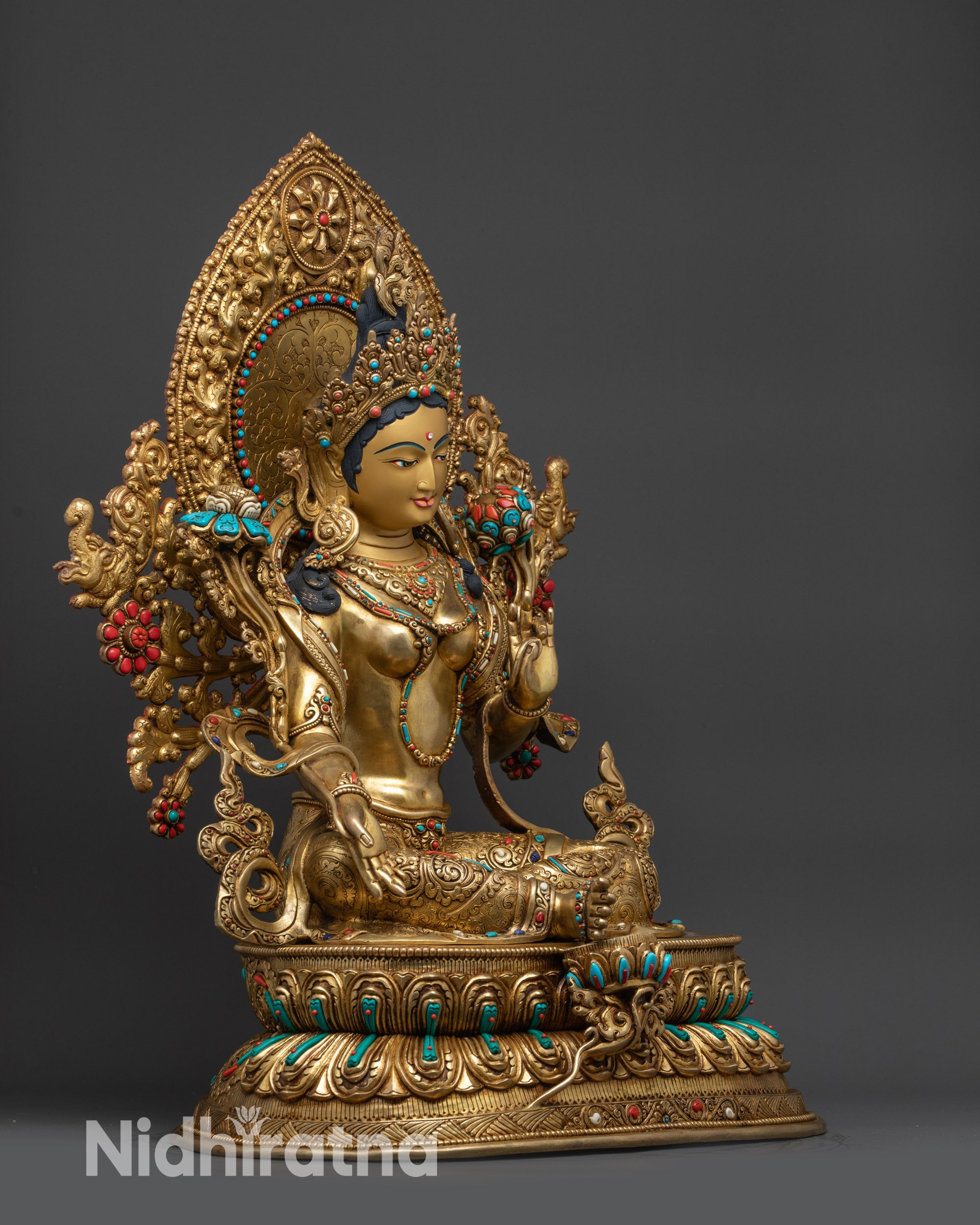 right view side Green Tara statue Lalitasana posture, double lotus seat, sacred Himalayan art