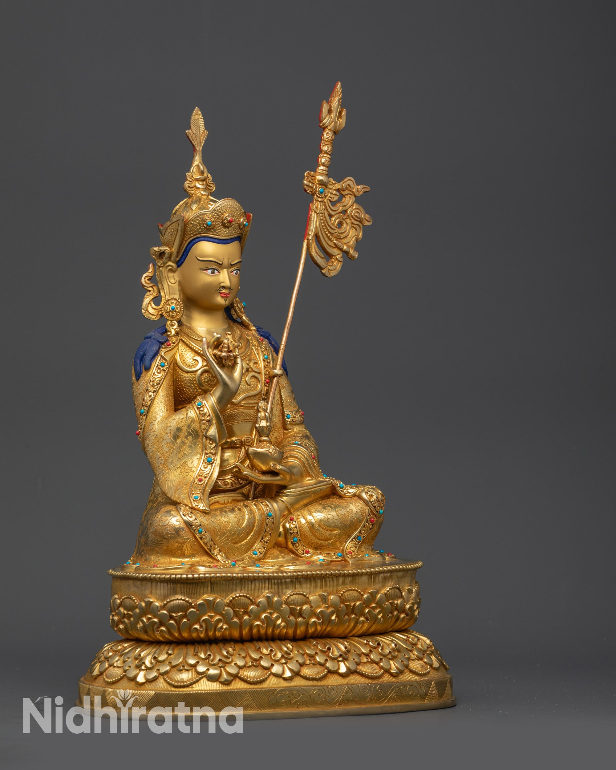 right view side Tsokye Dorje sculpture with trident on shoulder and carved kasaya robe