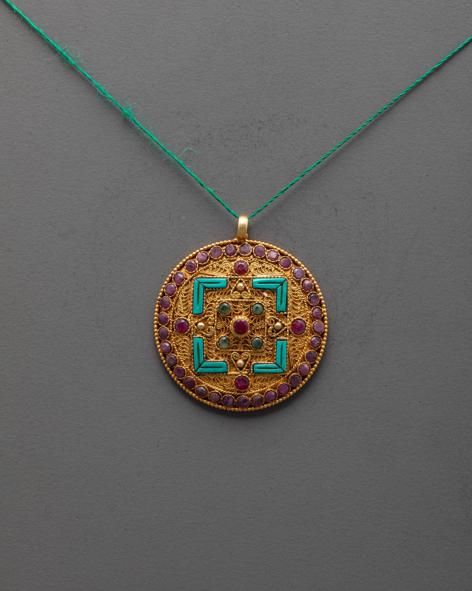 sacred mandala locket front view with gold-plated finish and intricate filigree design