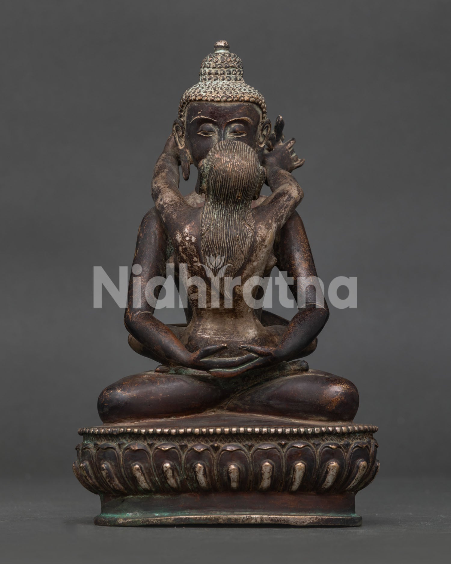 Samantabhadra with consort statue in oxidized copper seated on lotus throne front view.