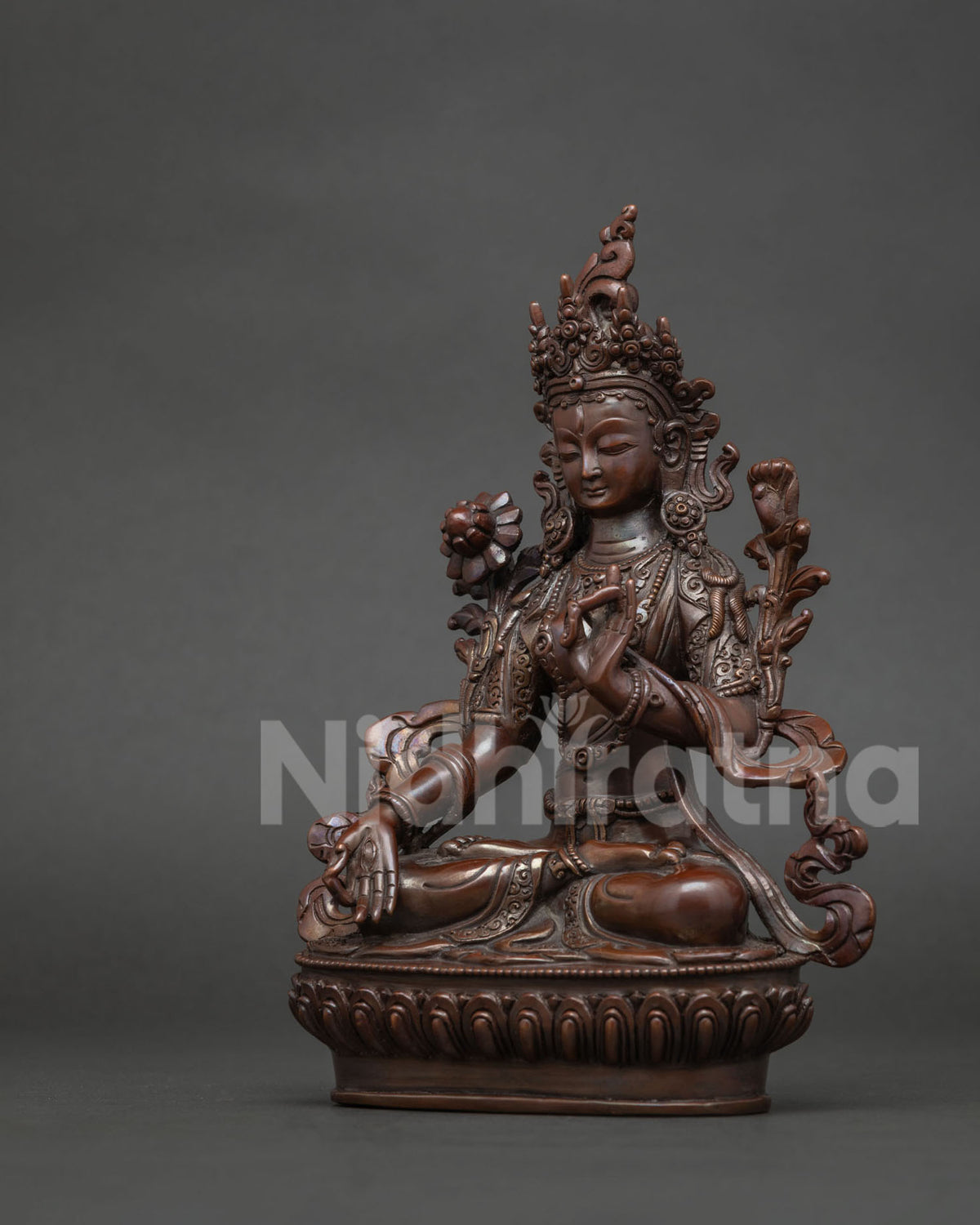 Seven eyed White tara statue symbolizing compassion healing longevity and protection.