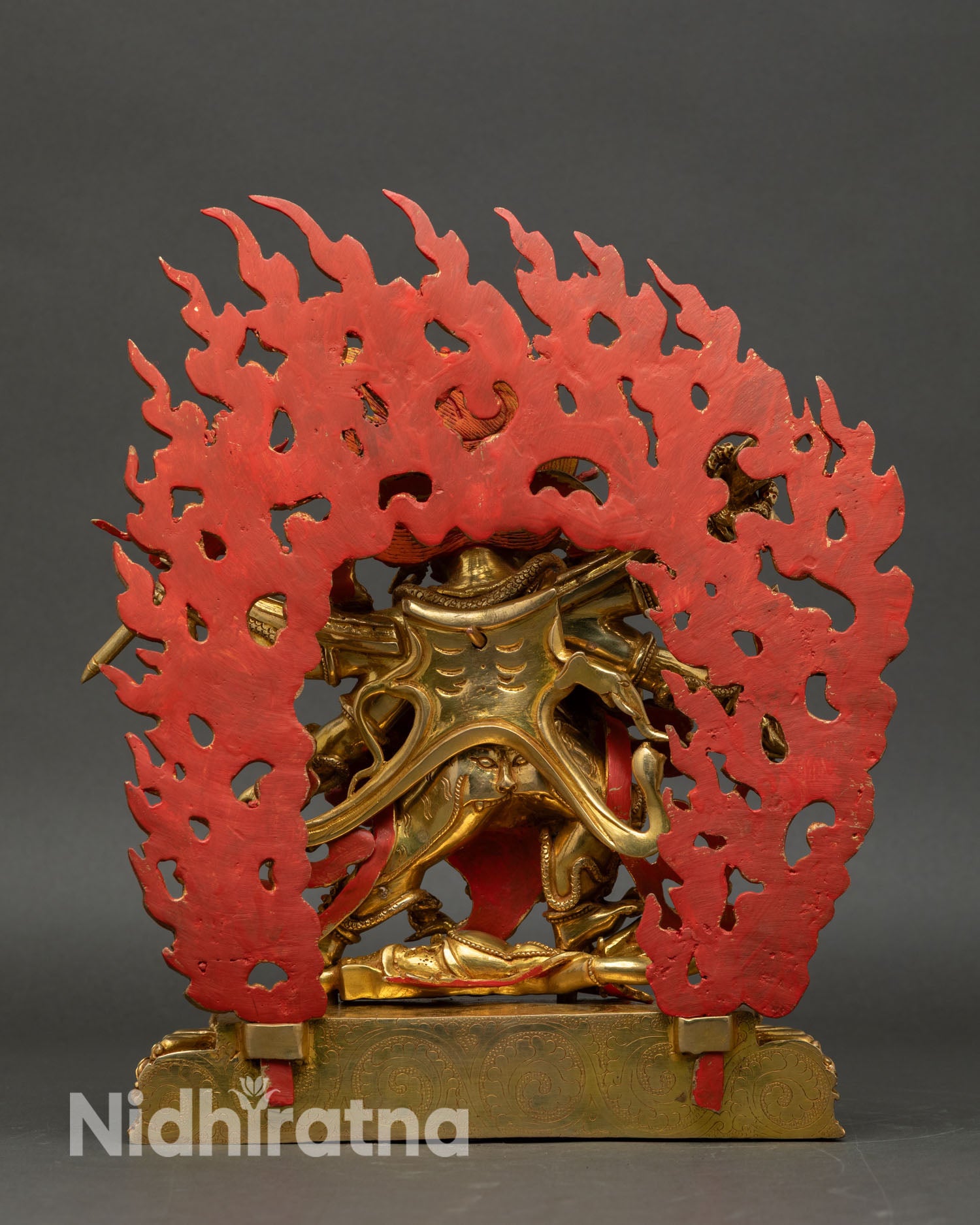 Shadbhuja Mahakala statue back view, wrathful protector deity, wisdom flames halo, sacred art