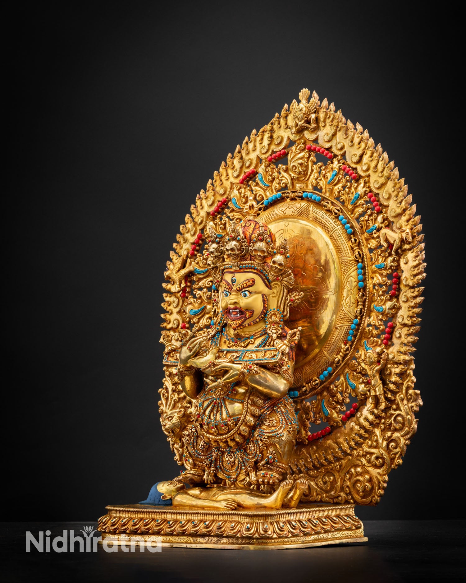 Shakya Mahakala statue right side view lost wax copper sculpture gold gilded accents ritual implements Buddhist protector art
